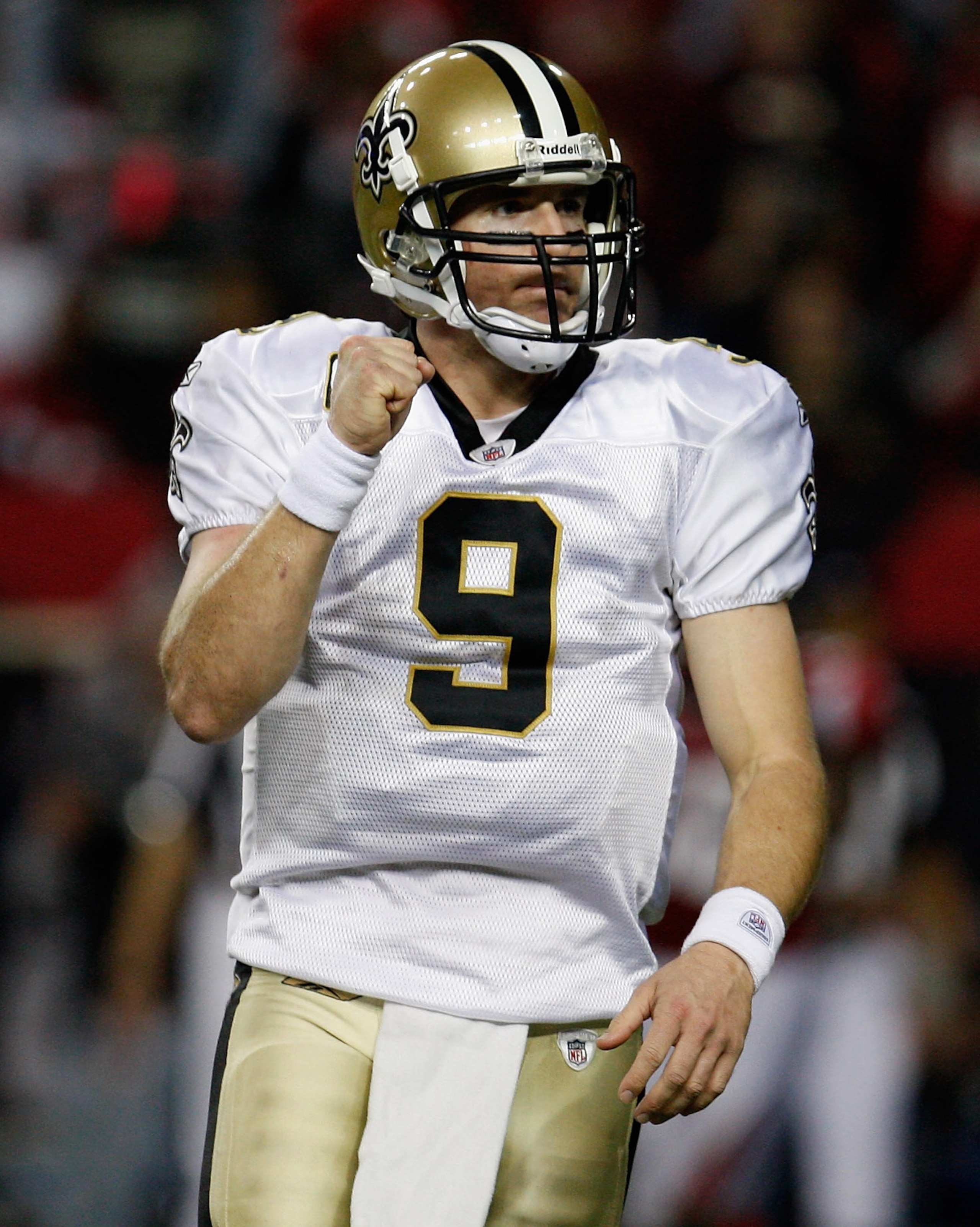 ATLANTA, GA - DECEMBER 27:  Quarterback Drew Brees #9 of the New Orleans Saints celebrates a touchdown pass to Jimmy Graham in the second half during the game against the Atlanta Falcons at the Georgia Dome on December 27, 2010 in Atlanta, Georgia.  (Phot