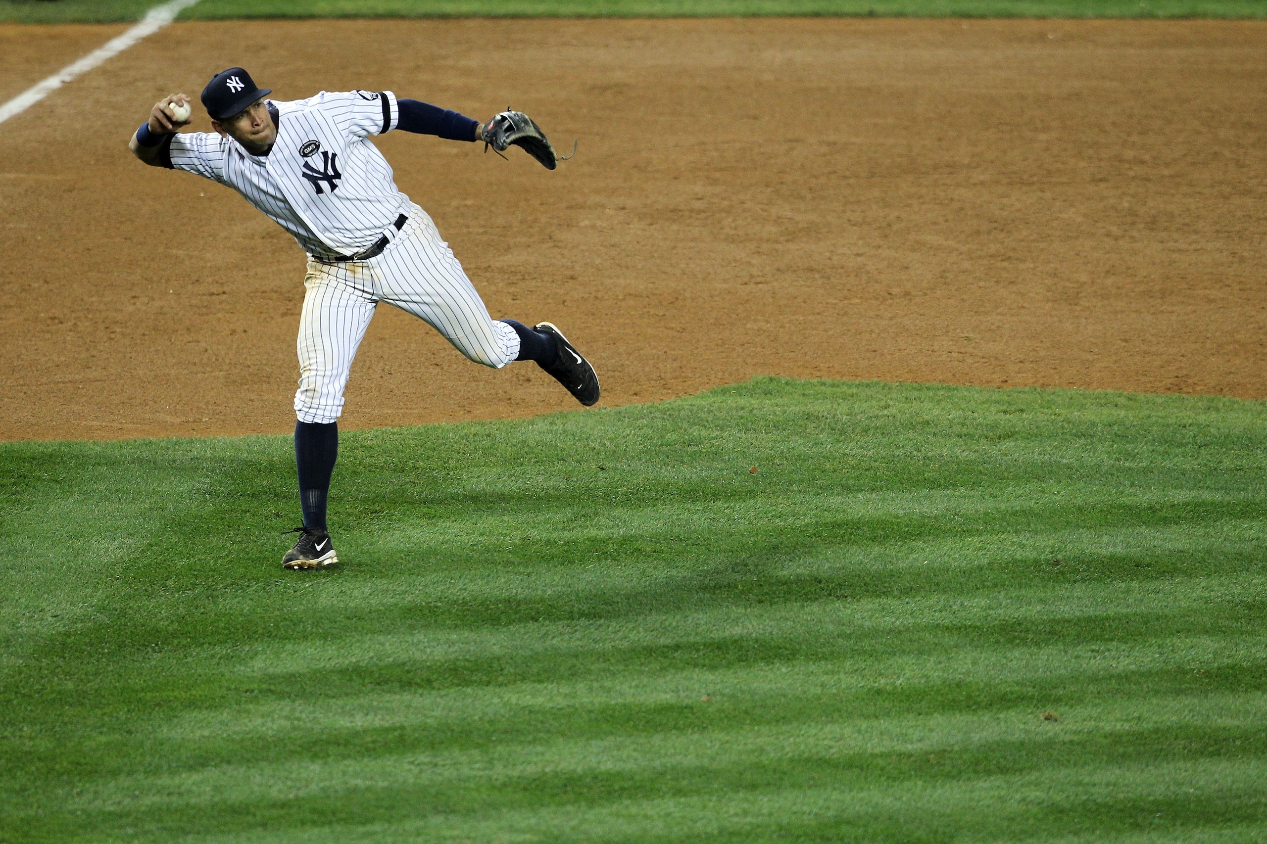 NEW YORK - OCTOBER 19:  Alex Rodriguez #13 of the New York Yankees throws the ball to first base against the Texas Rangers in Game Four of the ALCS during the 2010 MLB Playoffs at Yankee Stadium on October 19, 2010 in the Bronx borough of New York City. T