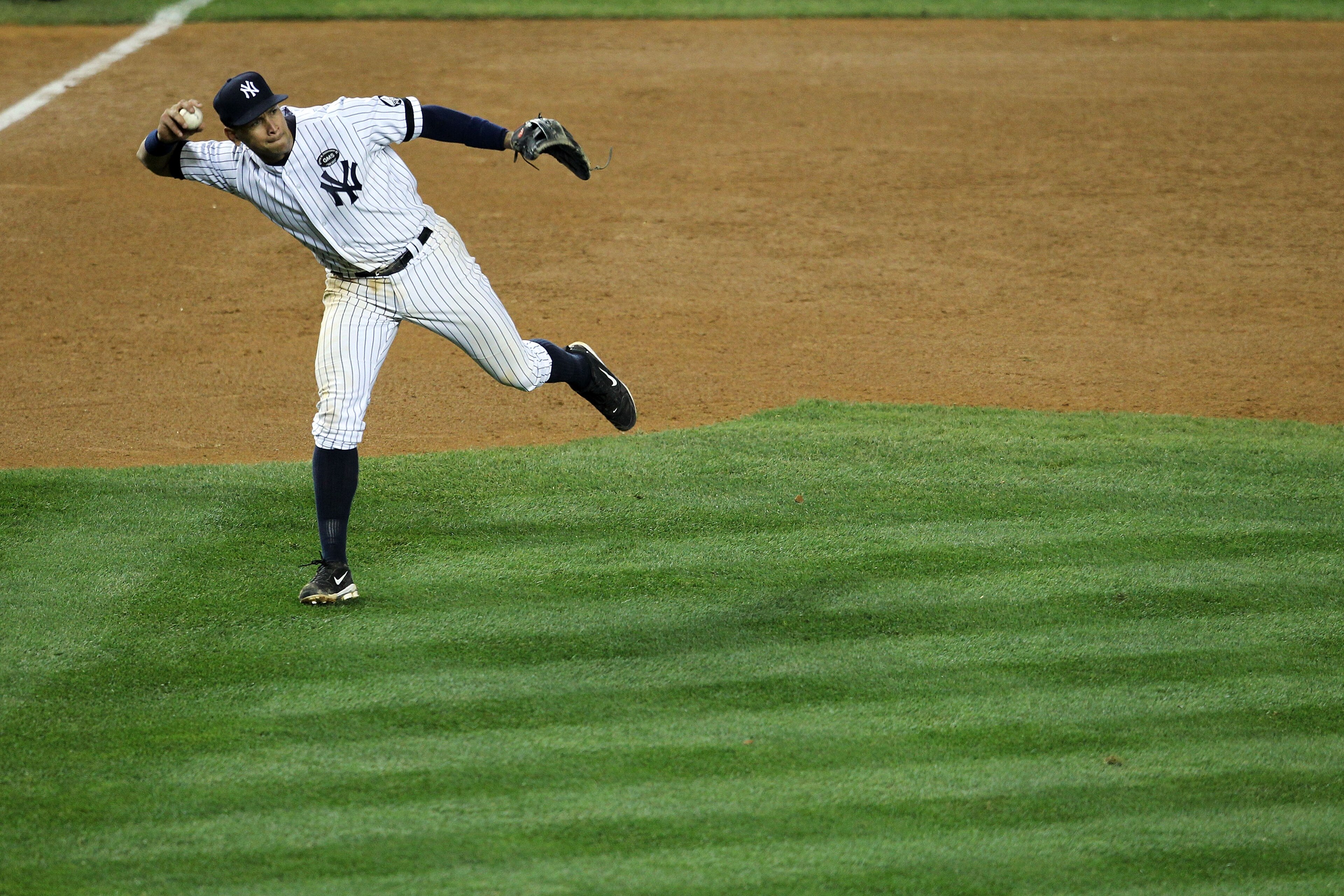 NEW YORK - OCTOBER 19:  Alex Rodriguez #13 of the New York Yankees throws the ball to first base against the Texas Rangers in Game Four of the ALCS during the 2010 MLB Playoffs at Yankee Stadium on October 19, 2010 in the Bronx borough of New York City. T