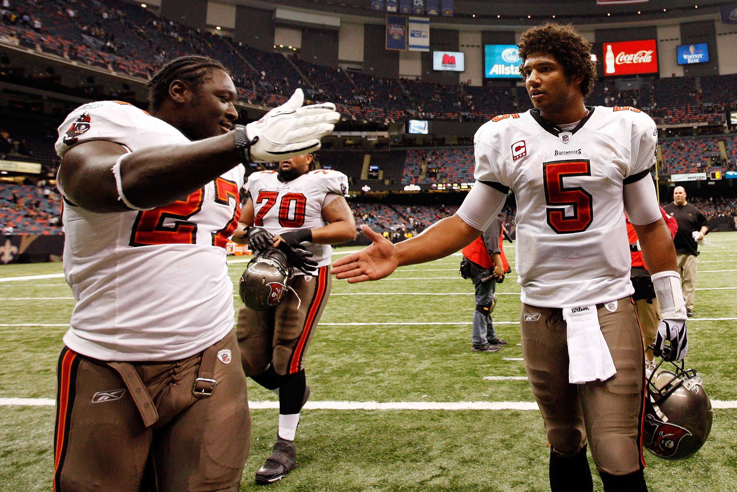 NEW ORLEANS, LA - JANUARY 02:  Quarterback Josh Freeman #5  celebrates with LeGarrette Blount #27 of the Tampa Bay Buccaneers after defeating the New Orleans Saints 23-13 at the Louisiana Superdome on January 2, 2011 in New Orleans, Louisiana.   (Photo by
