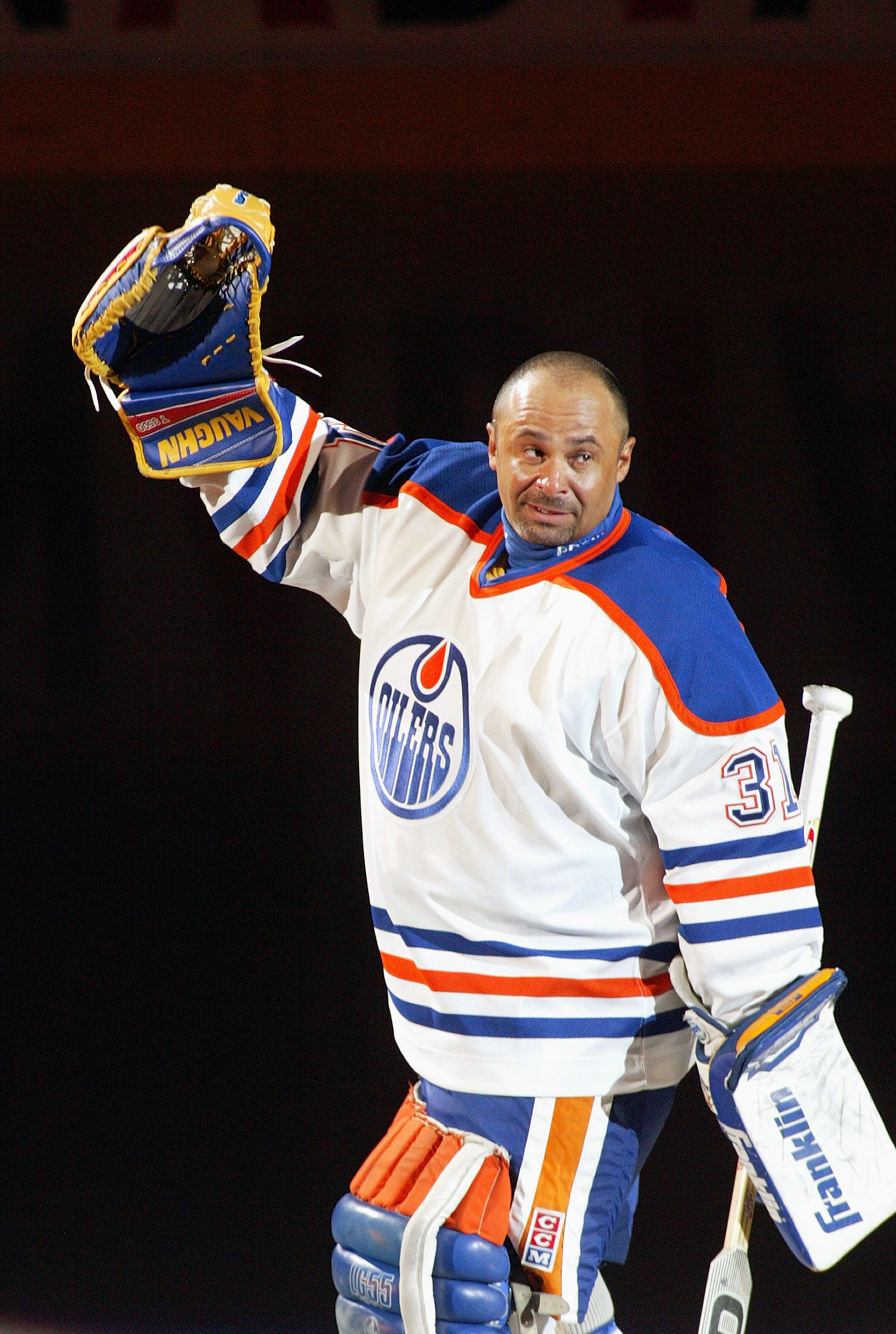 EDMONTON, AB - OCTOBER 9:  Hall of Fame goaltender Grant Fuhr waves to the crowd of 16,839 after the ceremony to retire his number 31 by the Edmonton Oilers before the game against the San Jose Sharks at the Skyreach Centre on October 9, 2003 in Edmonton,