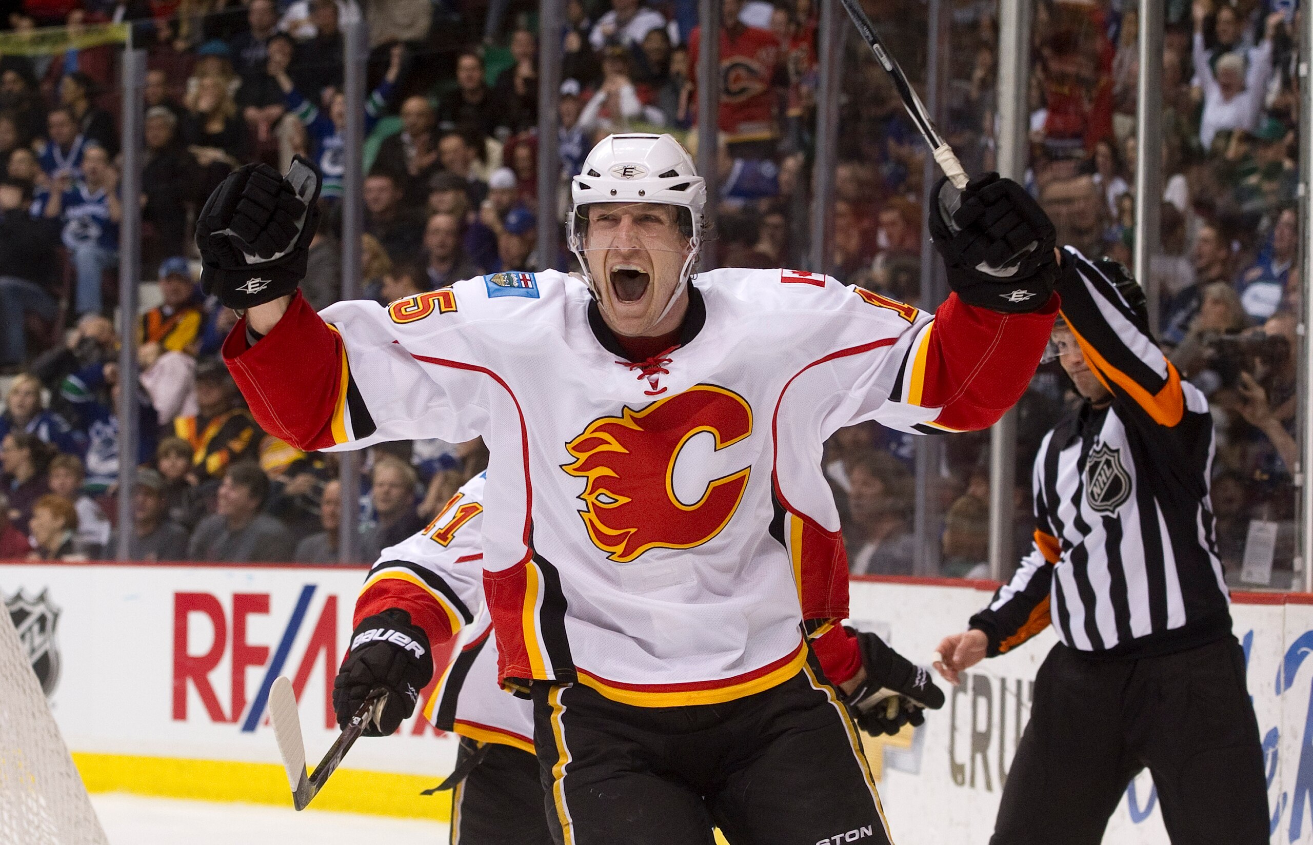 VANCOUVER, CANADA - JANUARY 22: Tim Jackman #15 of the Calgary Flames celebrates after scoring against the Vancouver Canucks during the third period in NHL action on January 22, 2011 at Rogers Arena in Vancouver, British Columbia, Canada.  (Photo by Rich