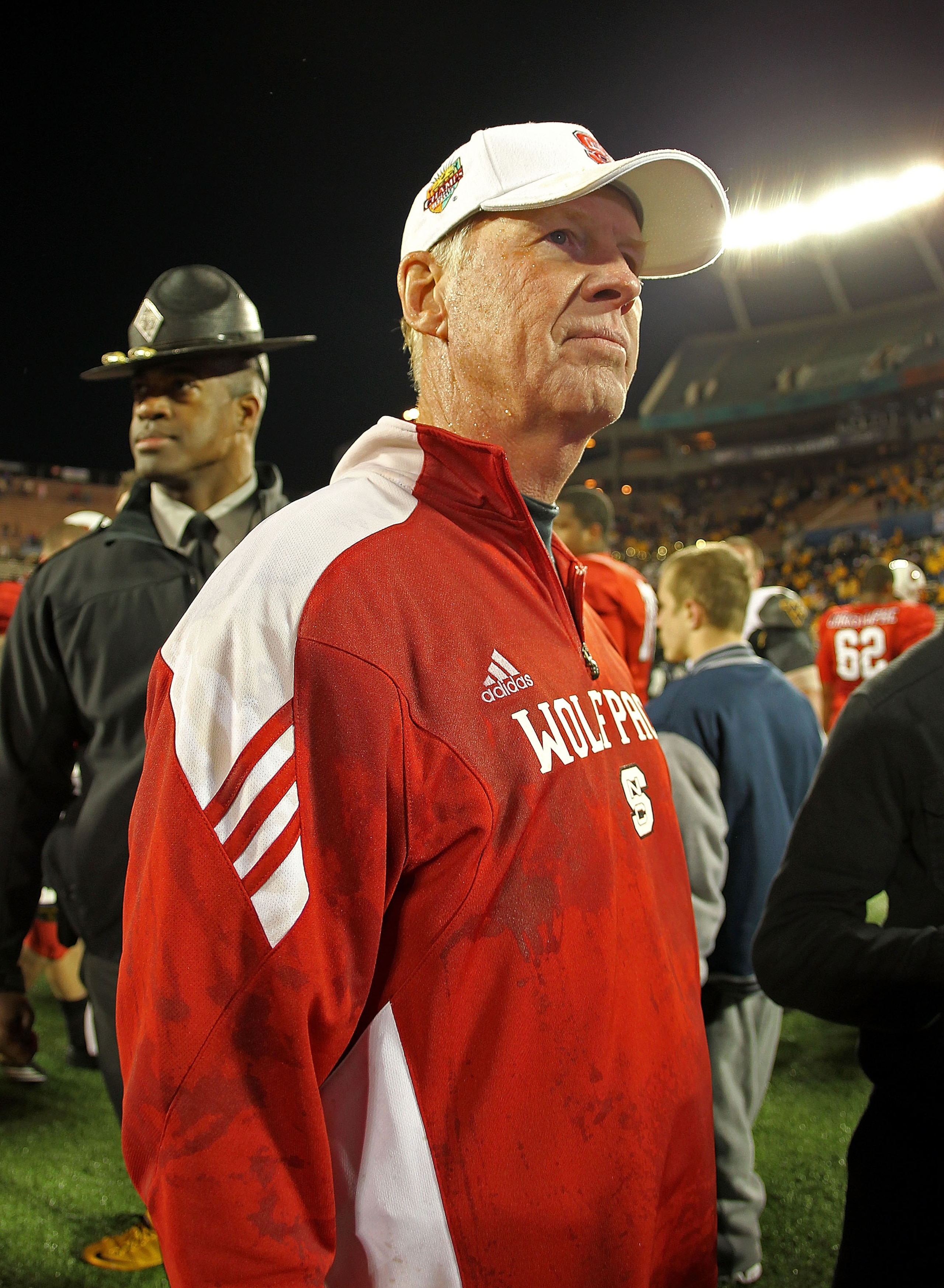 ORLANDO, FL - DECEMBER 28:  North Carolina State Wolfpack head coach Tom O'Brien celebrates after winning  the Champs Sports Bowl against the West Virginia Mountineers at Florida Citrus Bowl Stadium on December 28, 2010 in Orlando, Florida.  (Photo by Mik