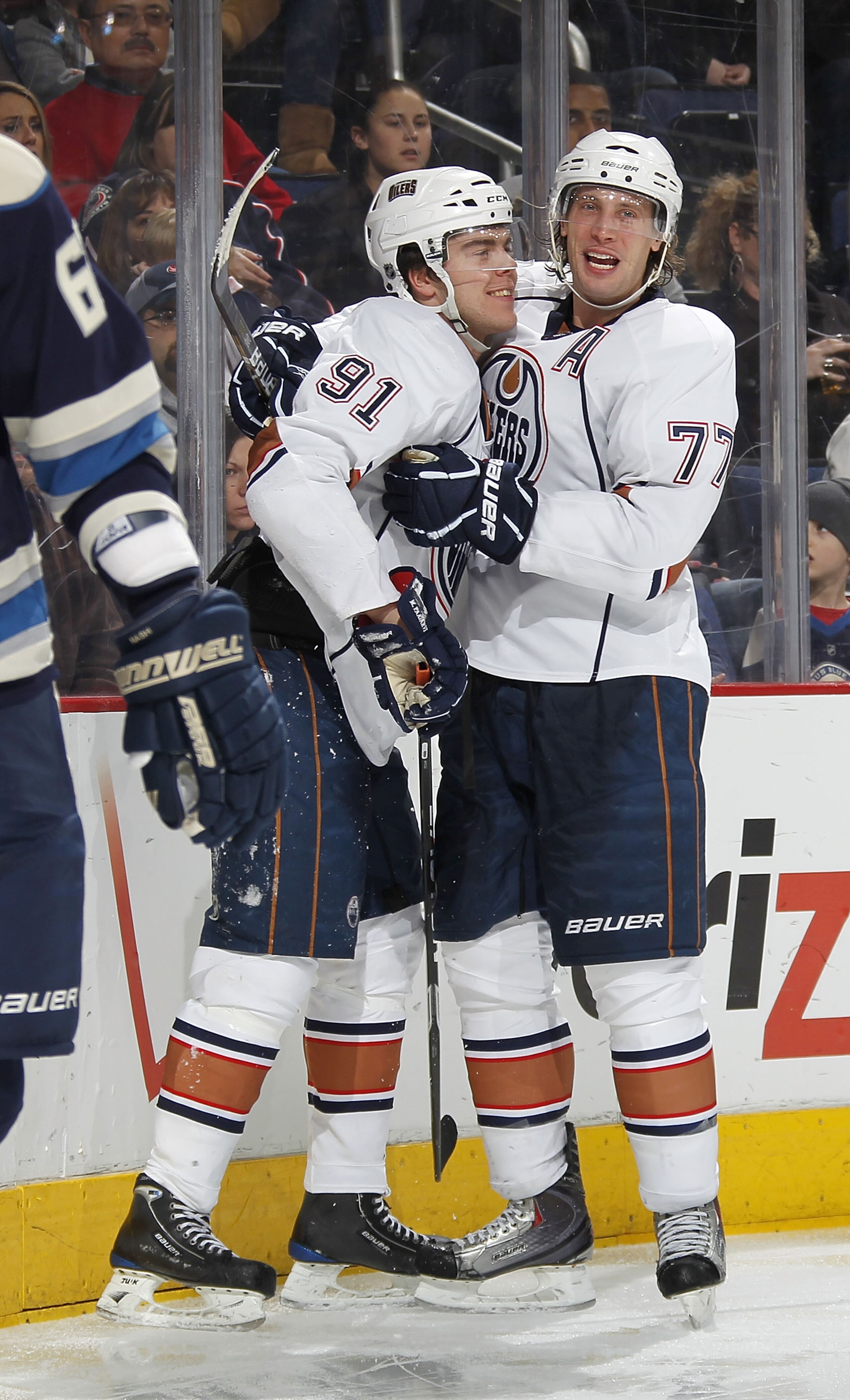 COLUMBUS, OH - FEBRUARY 05:  Magnus Paajarvi #91 of the Edmonton Oilers celebrates a third period goal with Tom Gilbert #77 while playing the Columbus Blue Jackets at Nationwide Arena on February 5, 2011 in Columbus, Ohio. Columbus won the game 4-3. (Phot