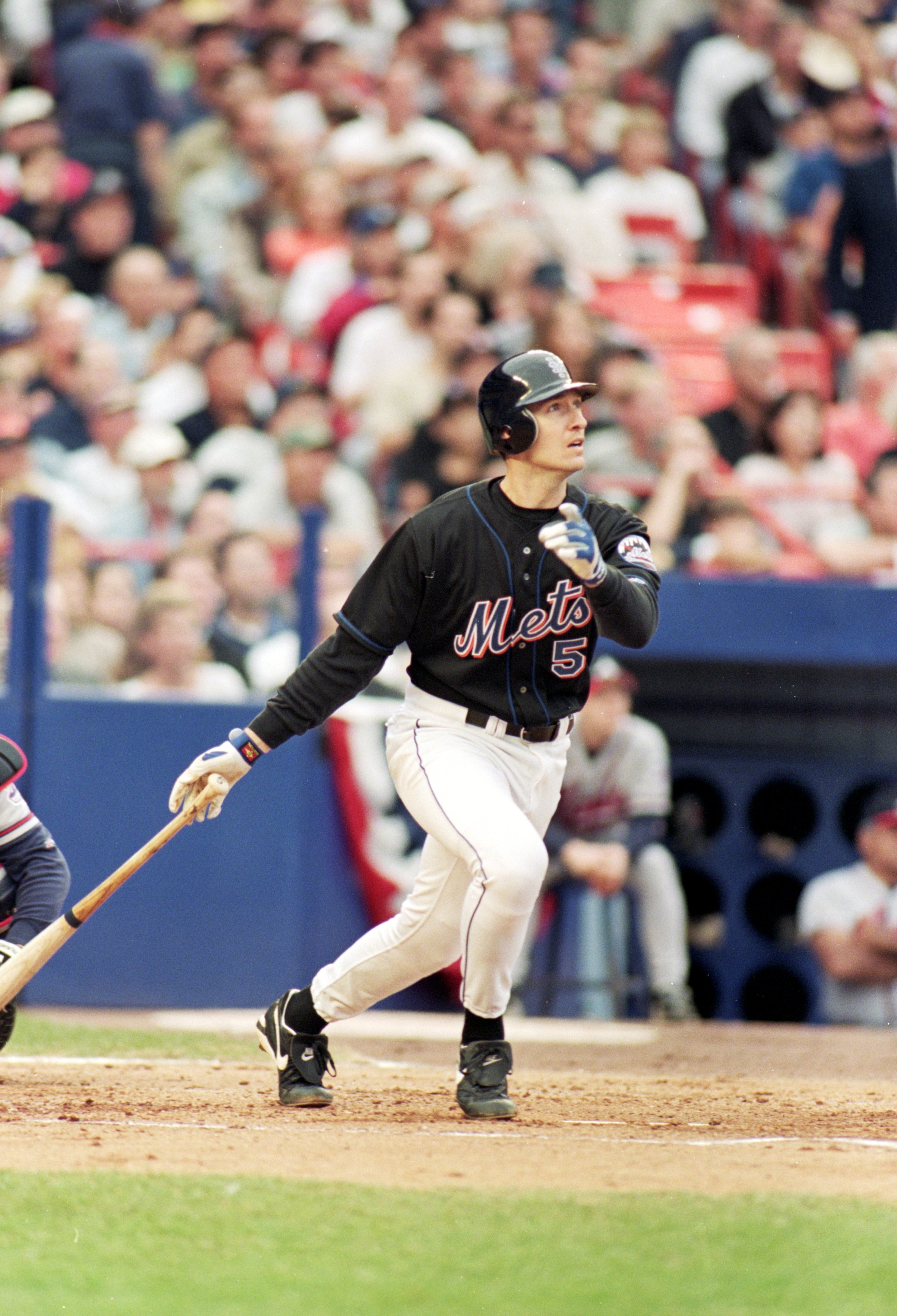 17 Oct 1999:  John Olerud #5 of the New York Mets watches the ball as he hits a home run during the NLCS game four against the Atlanta Braves at Shea Stadium in Flushing, New York. The Mets defeated the Braves 4-3. Mandatory Credit: Al Bello  /Allsport