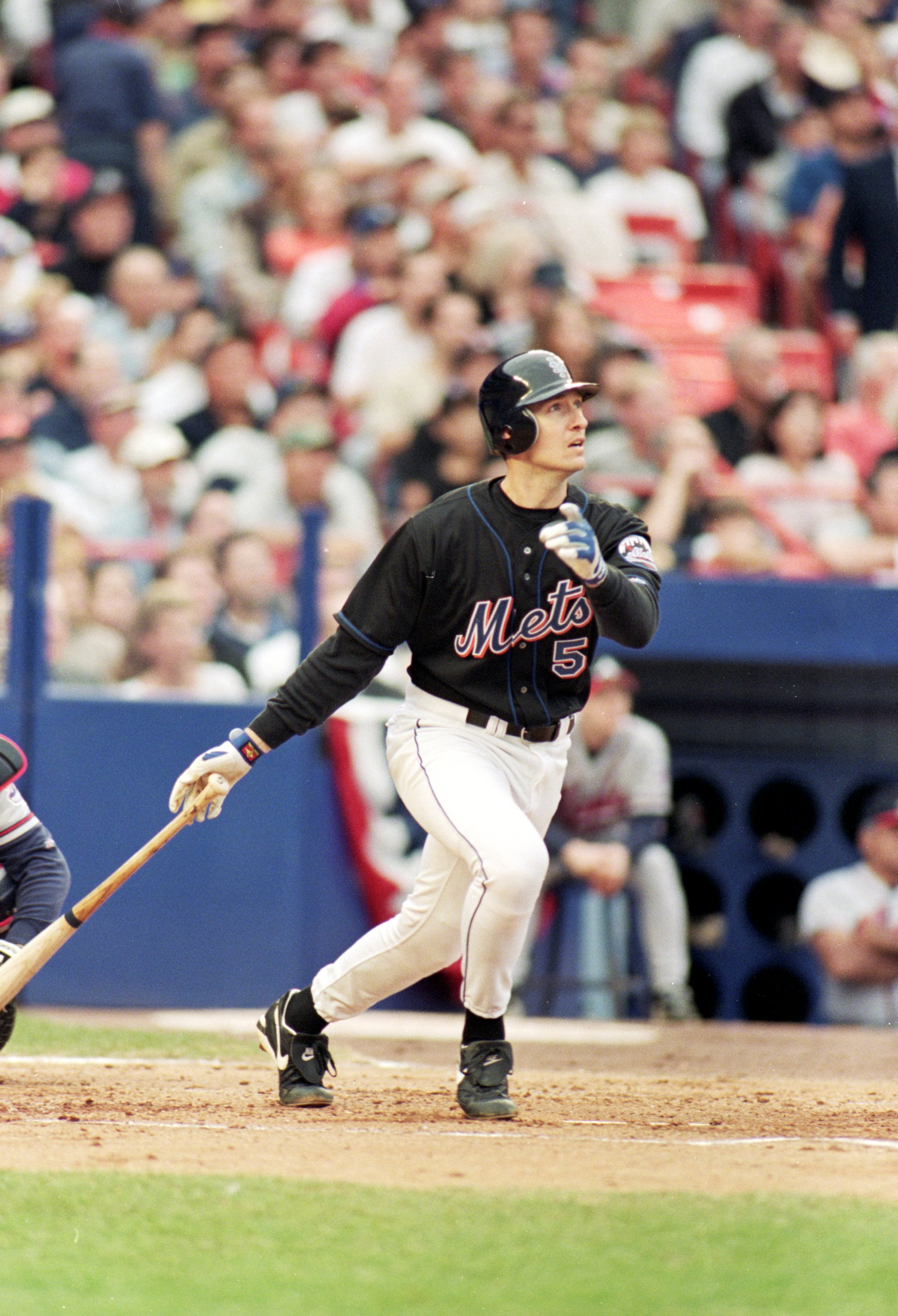 17 Oct 1999:  John Olerud #5 of the New York Mets watches the ball as he hits a home run during the NLCS game four against the Atlanta Braves at Shea Stadium in Flushing, New York. The Mets defeated the Braves 4-3. Mandatory Credit: Al Bello  /Allsport