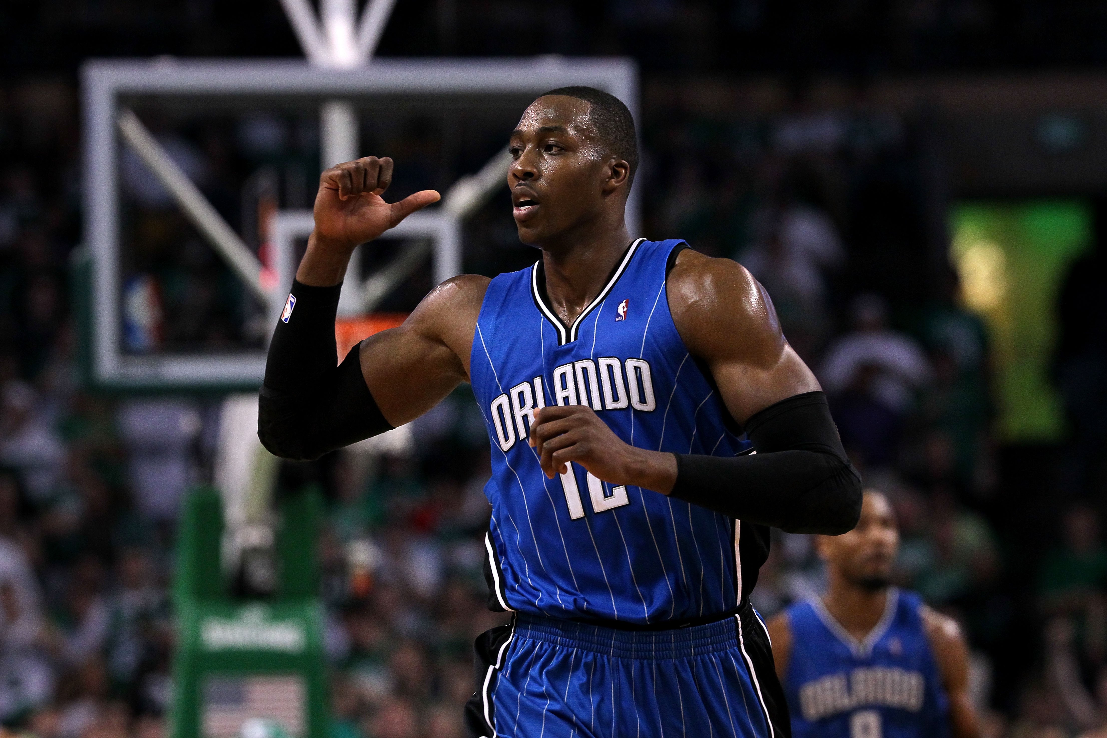 BOSTON - MAY 28:  Dwight Howard #12 of the Orlando Magic gestures as he runs up court against the Boston Celtics in Game Six of the Eastern Conference Finals during the 2010 NBA Playoffs at TD Garden on May 28, 2010 in Boston, Massachusetts.  NOTE TO USER
