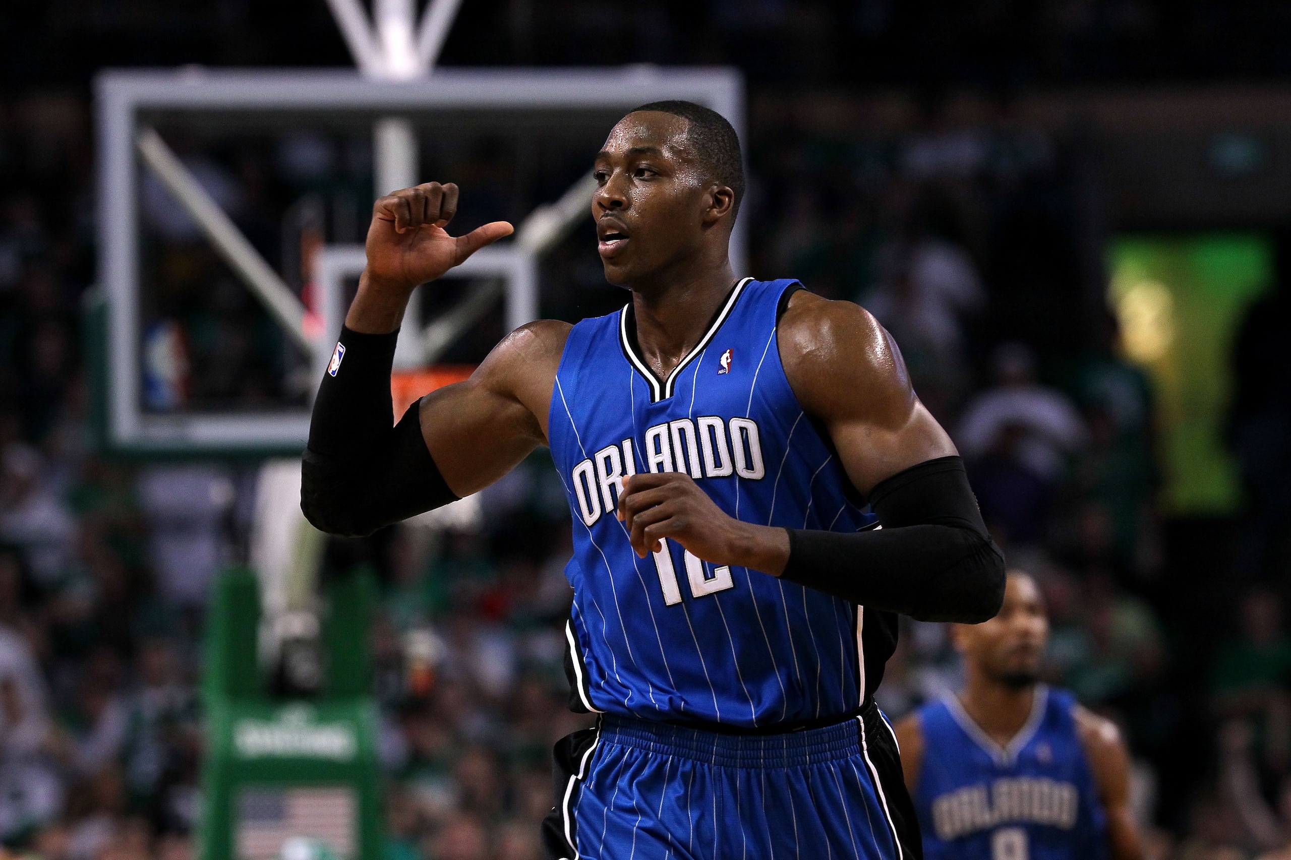 BOSTON - MAY 28: Dwight Howard #12 of the Orlando Magic gestures as he runs up court against the Boston Celtics in Game Six of the Eastern Conference Finals during the 2010 NBA Playoffs at TD Garden on May 28, 2010 in Boston, Massachusetts. NOTE TO USER BOSTON - MAY 28: Dwight Howard #12 of the Orlando Magic gestures as he runs up court against the Boston Celtics in Game Six of the Eastern Conference Finals during the 2010 NBA Playoffs at TD Garden on May 28, 2010 in Boston, Massachusetts. NOTE TO USER