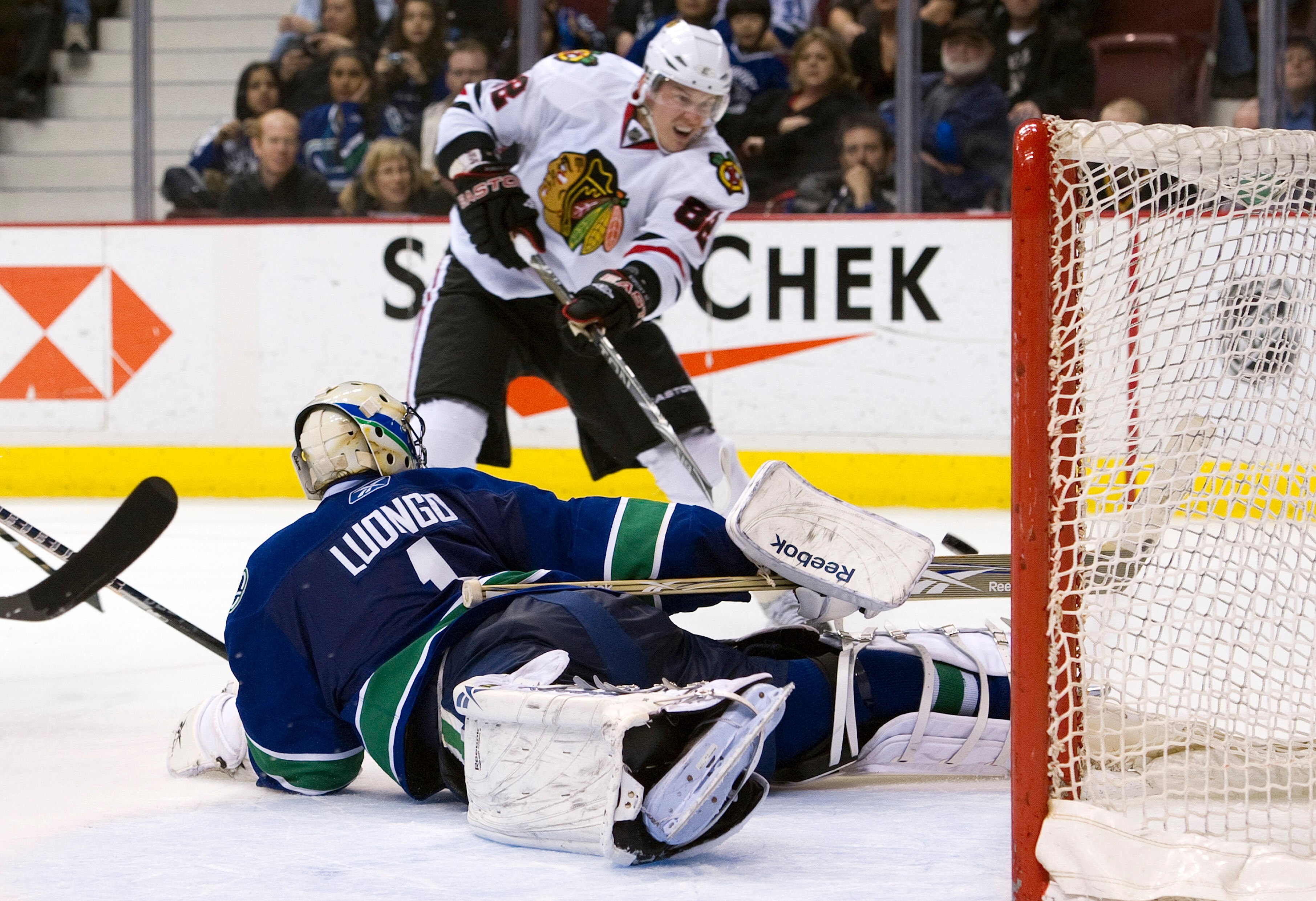 VANCOUVER, CANADA - JANUARY 4: Goalie Roberto Luongo #1 of the Vancouver Canucks sprawls and watches Tomas Kopecky #82 of the Chicago Blackhawks hit the post with his shot during the third period in NHL action on February 04, 2011 at Rogers Arena in Vanco