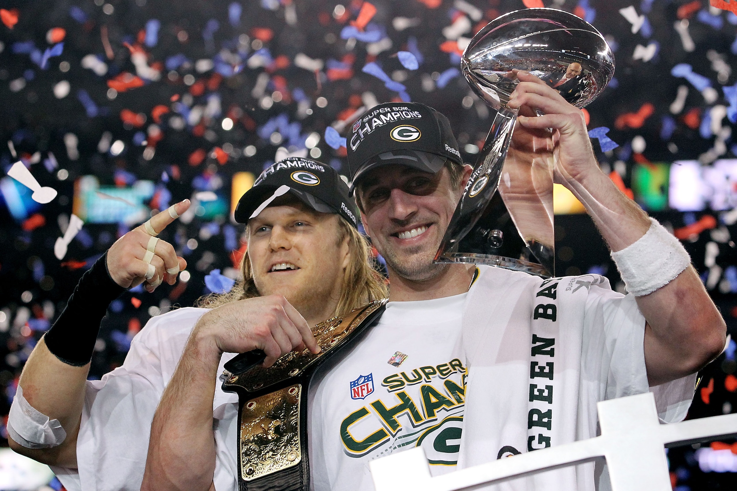 ARLINGTON, TX - FEBRUARY 06:  Aaron Rodgers #12 and Clay Matthews #52 of the Green Bay Packers of the Green Bay Packers holds the Lombardi Trophy after defeating the Pittsburgh Steelers 31-25 during Super Bowl XLV at Cowboys Stadium on February 6, 2011 in