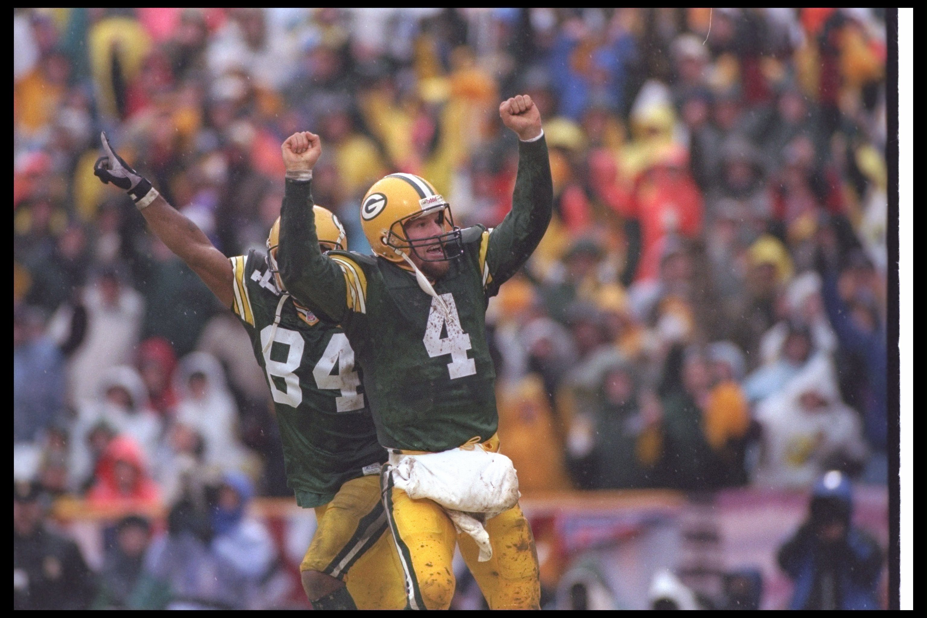 4 Jan 1997: Quarterback Brett Favre of the Green Bay Packers celebrates during a playoff game against the San Francisco 49ers at Lambeau Field in Green Bay, Wisconsin. The Packers won the game, 35-14. Mandatory Credit: Brian Bahr /Allsport