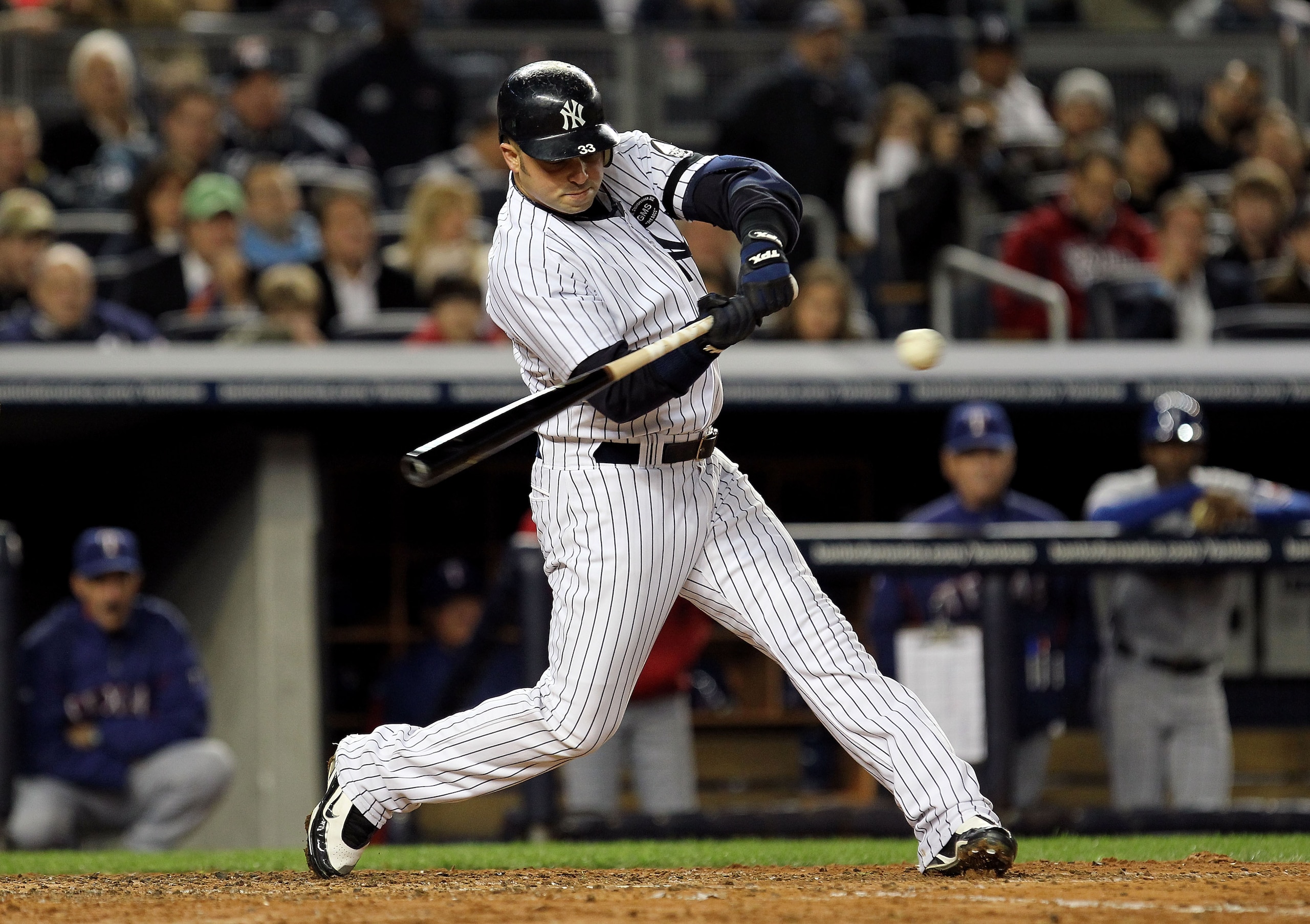 NEW YORK - OCTOBER 18:  Nick Swisher #33 of the New York Yankees bats against the Texas Rangers in Game Three of the ALCS during the 2010 MLB Playoffs at Yankee Stadium on October 18, 2010 in New York, New York. The Rangers won 8-0.  (Photo by Al Bello/Ge