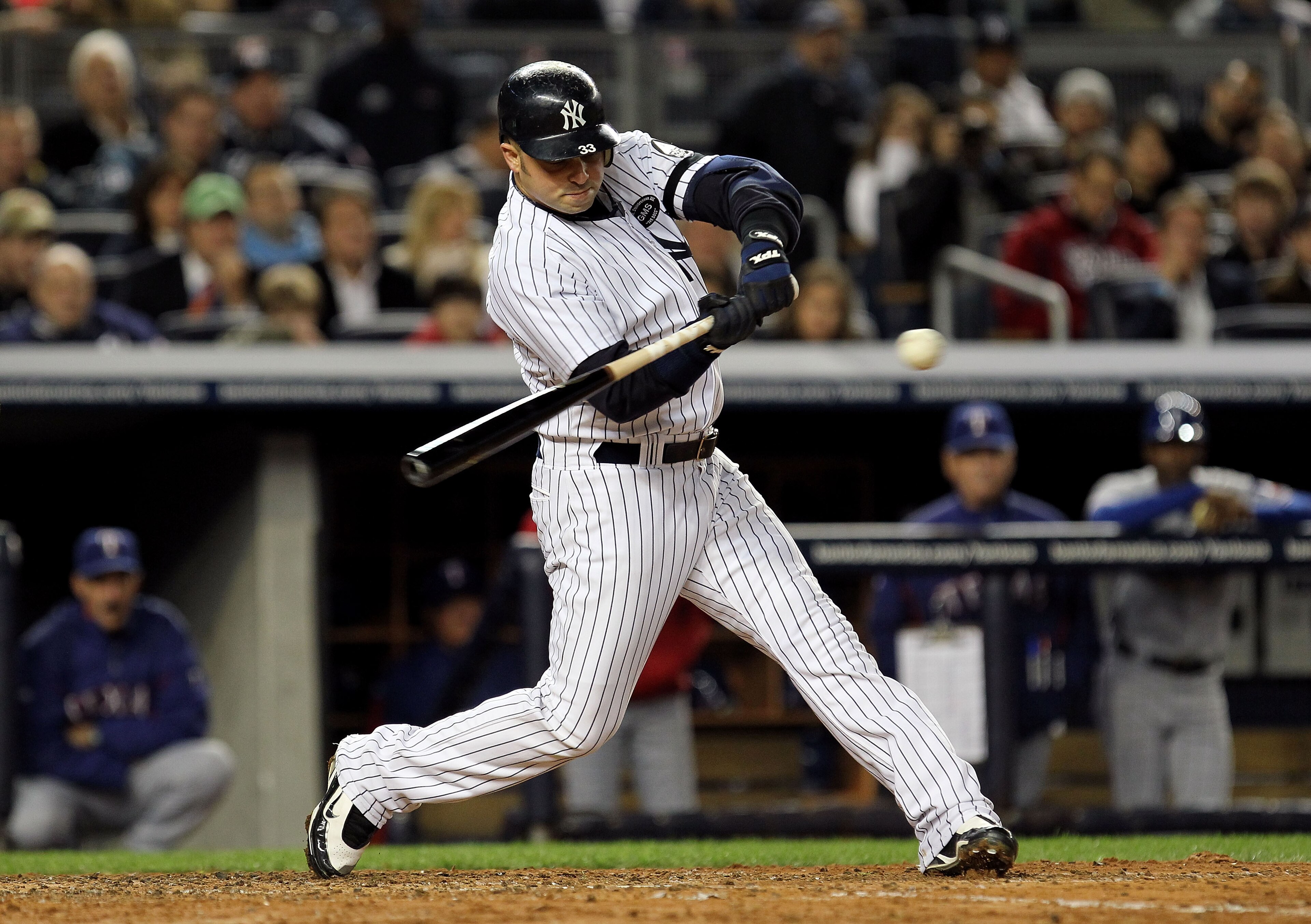 NEW YORK - OCTOBER 18: Nick Swisher #33 of the New York Yankees bats against the Texas Rangers in Game Three of the ALCS during the 2010 MLB Playoffs at Yankee Stadium on October 18, 2010 in New York, New York. The Rangers won 8-0. (Photo by Al Bello/Ge NEW YORK - OCTOBER 18: Nick Swisher #33 of the New York Yankees bats against the Texas Rangers in Game Three of the ALCS during the 2010 MLB Playoffs at Yankee Stadium on October 18, 2010 in New York, New York. The Rangers won 8-0. (Photo by Al Bello/Ge