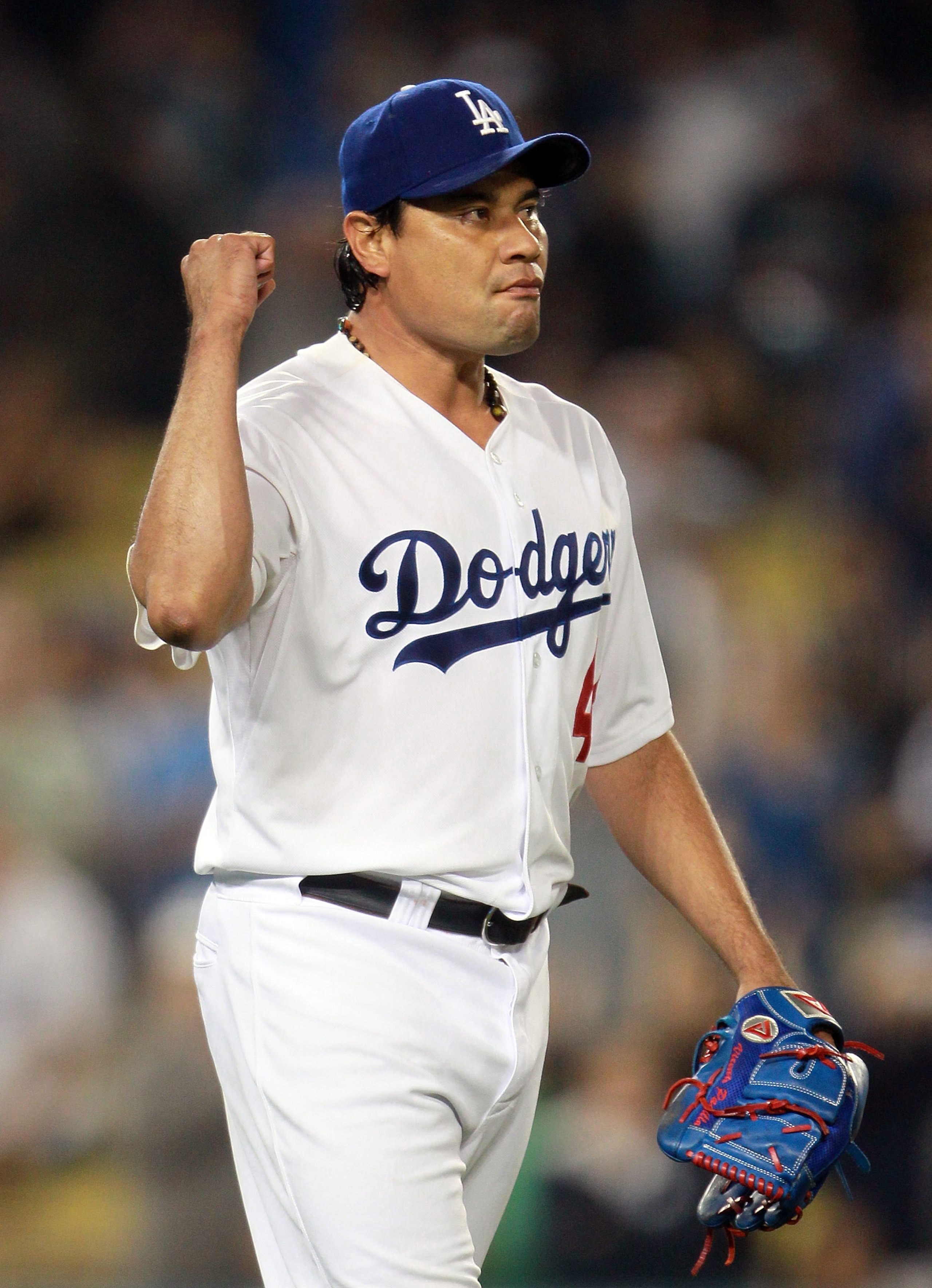 LOS ANGELES, CA - AUGUST 04:  Starting pitcher Vicente Padilla #44 of the Los Angeles Dodgers celebrates after the final out in the ninth inning against the San Diego Padres at Dodger Stadium on August 4, 2010 in Los Angeles, California. The Dodgers defea
