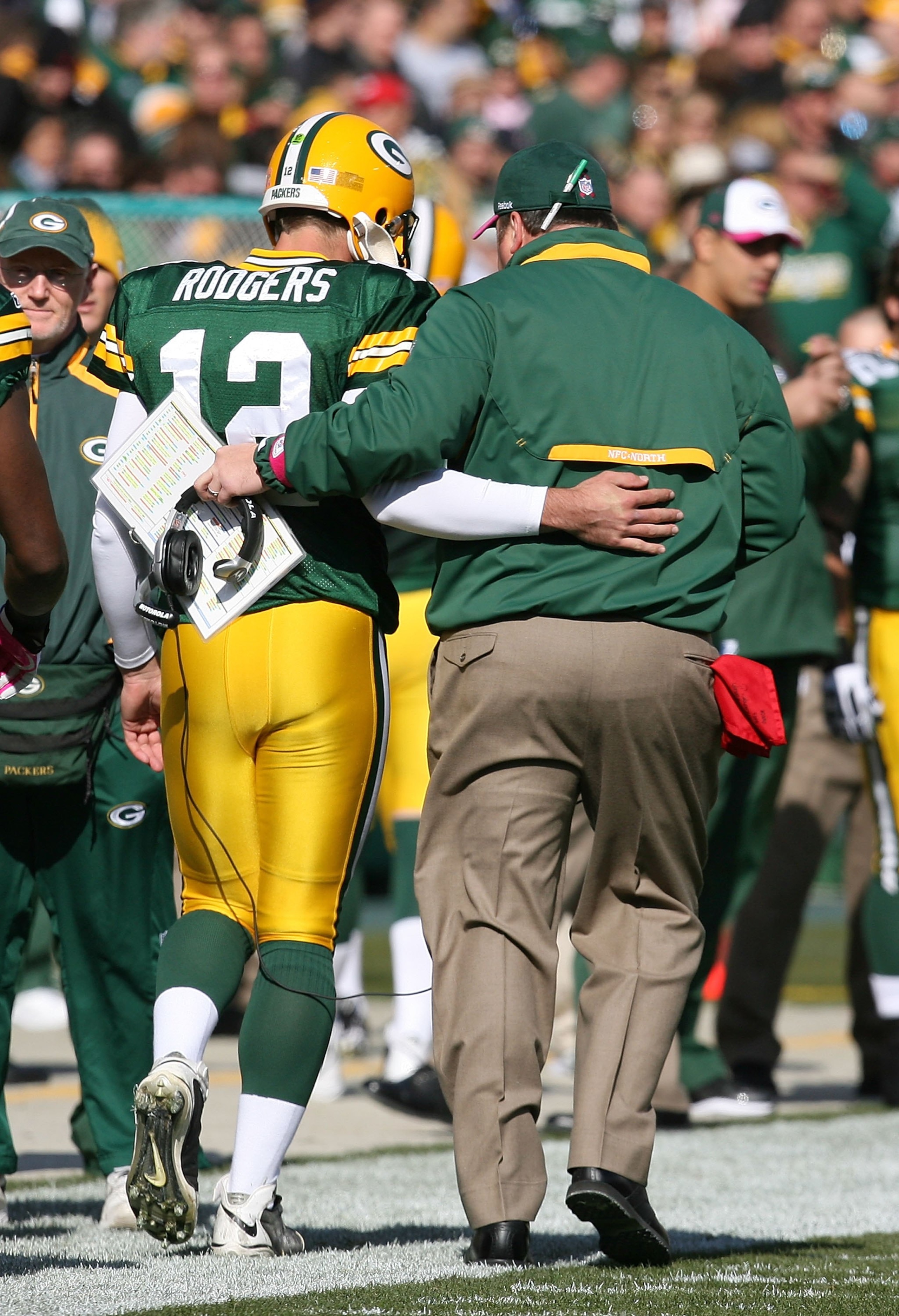 GREEN BAY, WI - OCTOBER 18: Aaron Rodgers #12 of the Green Bay Packers talks with head coach Mike McCarthy during a game against the Detroit Lions at Lambeau Field on October 18, 2009 in Green Bay, Wisconsin. The Packers defeated the Lions 26-0.  (Photo b