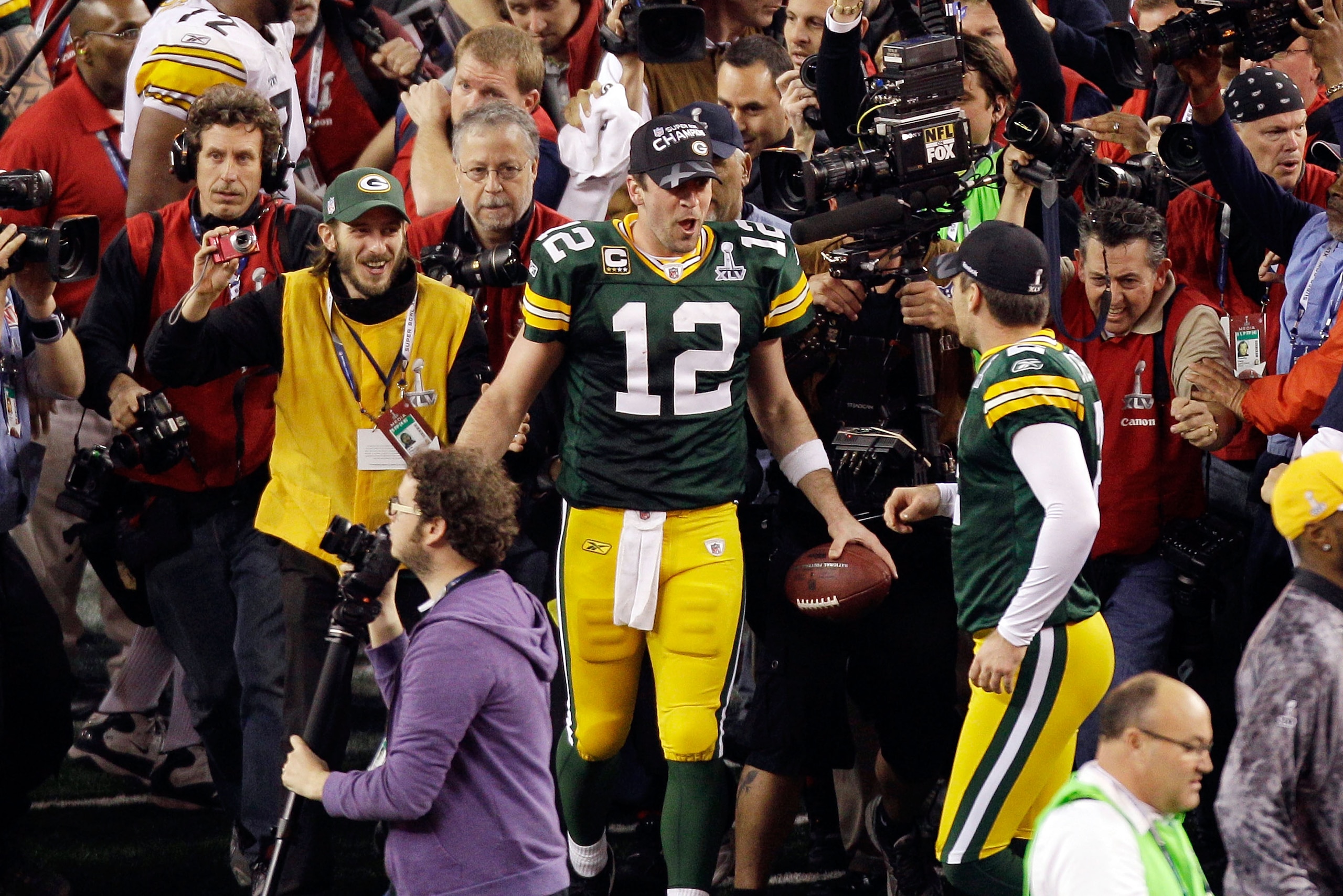 ARLINGTON, TX - FEBRUARY 06:  Aaron Rodgers #12 of the Green Bay Packers celebrates after they defeated the Pittsburgh Steelers 31 to 25 in Super Bowl XLV at Cowboys Stadium on February 6, 2011 in Arlington, Texas.  (Photo by Rob Carr/Getty Images)