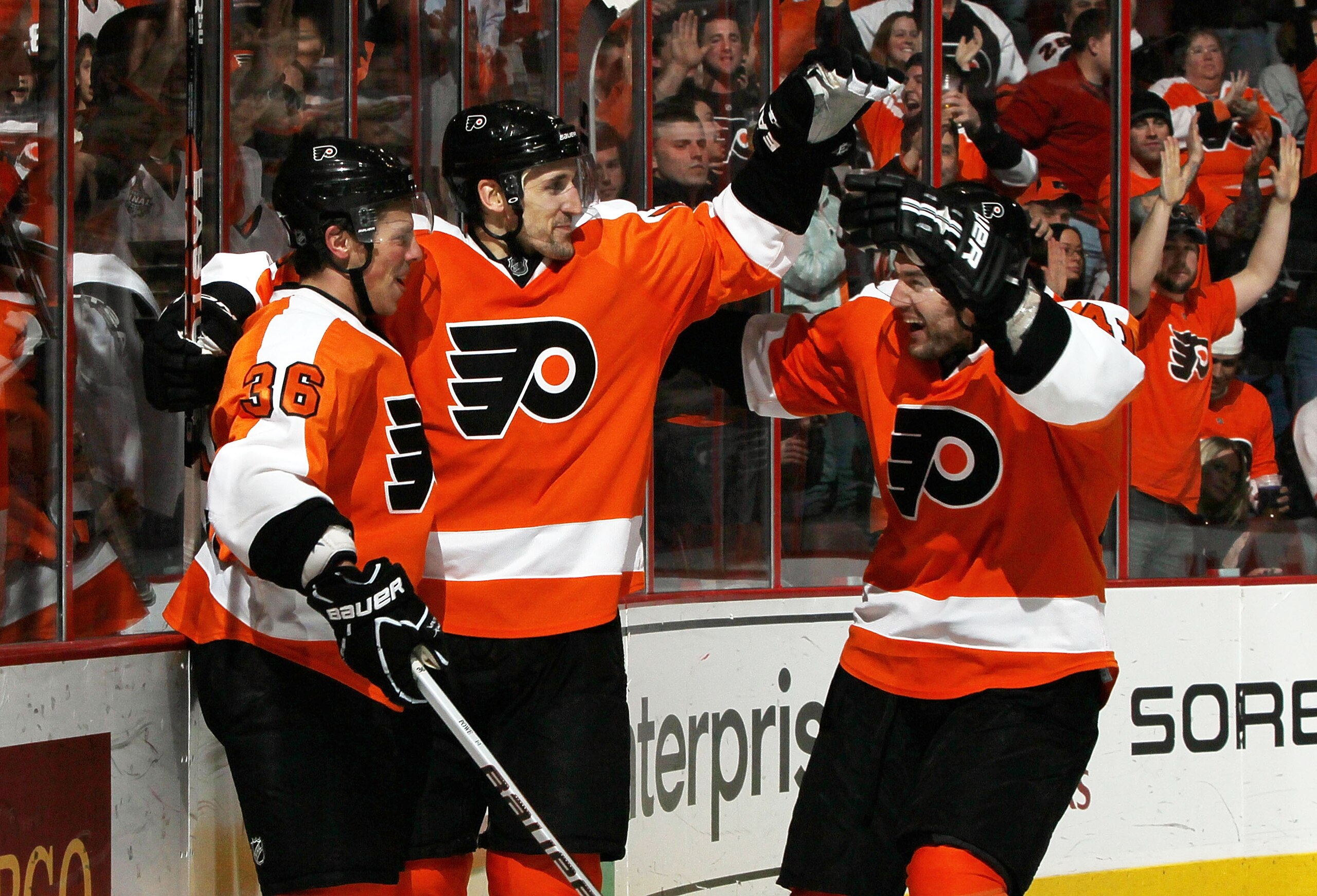 PHILADELPHIA, PA - FEBRUARY 05:  Darroll Powe #36 of the Philadelphia Flyers celebrates his second period shorthanded goal against the Dallas Stars with teammates Andrej Meszaros #41 and Blair Betts #11 on February 5, 2011 at Wells Fargo Center in Philade