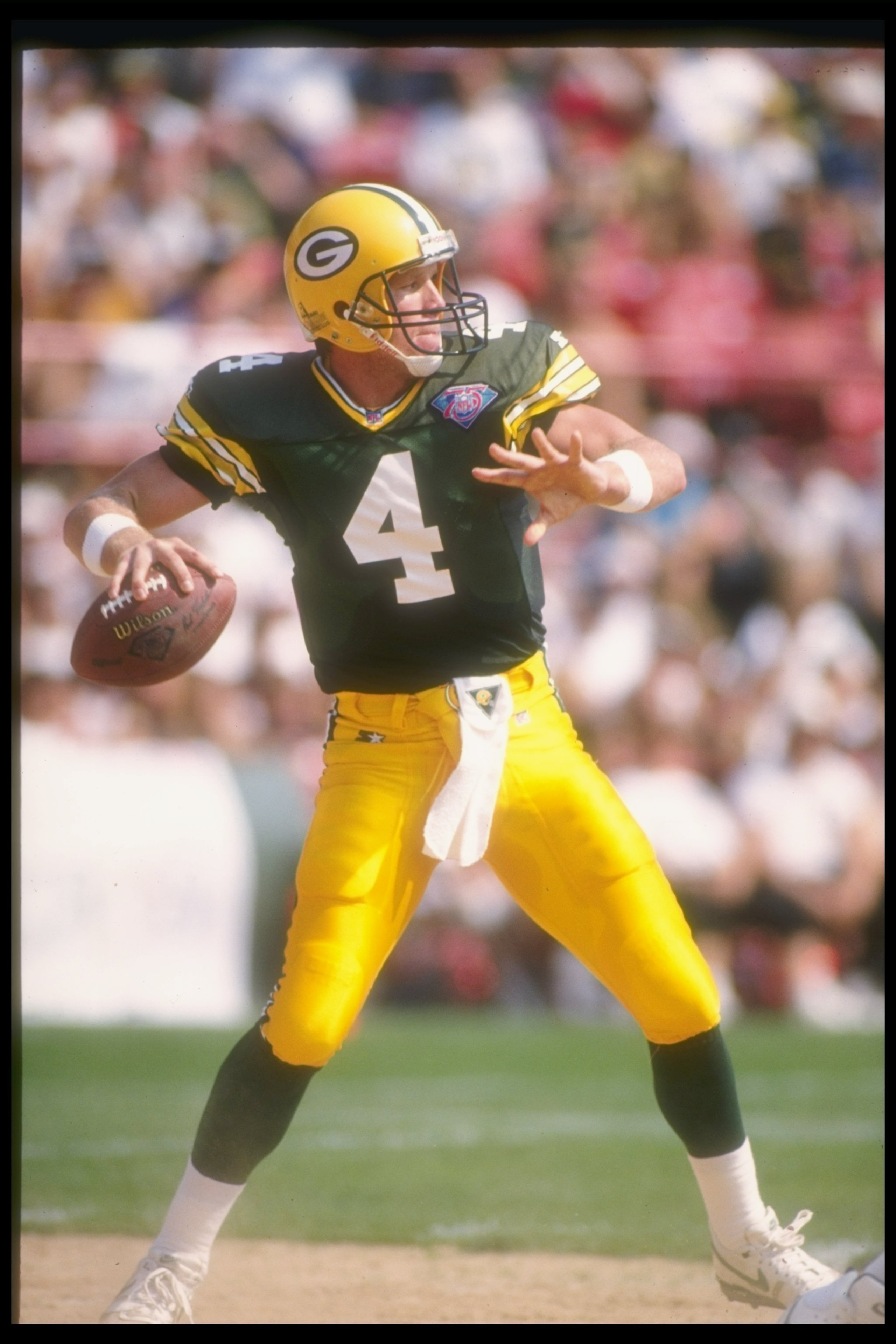 11 SEP 1994:  GREEN BAY QUARTERBACK BRETT FAVRE SETS AND THROWS DURING THE PACKERS 24-14 LOSS TO THE MIAMI DOLPHINS AT MILWAUKEE COUNTY STADIUM IN MILWAUKEE, WISCONSIN. Mandatory Credit: Jonathan Daniel  /Allsport