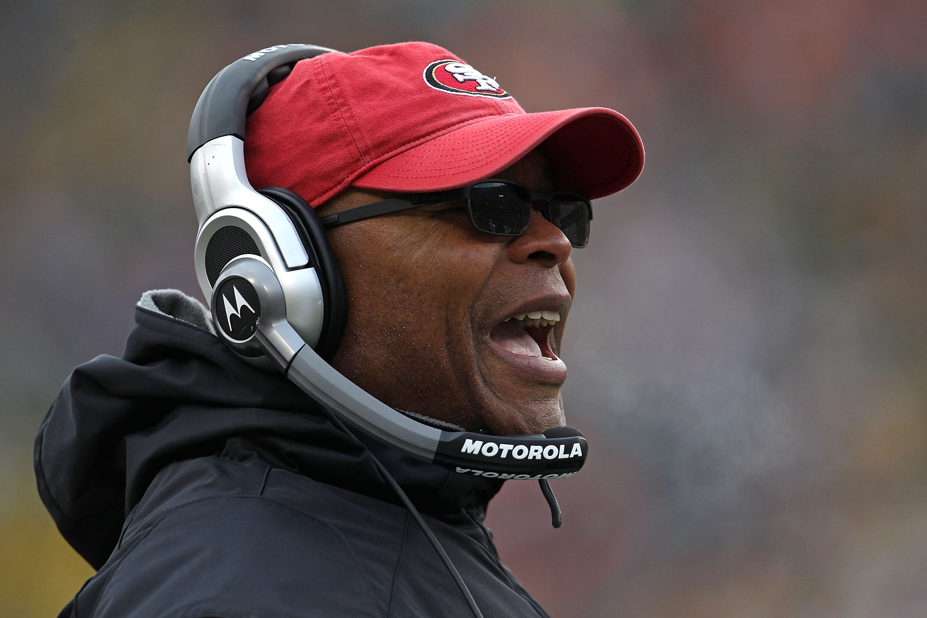 GREEN BAY, WI - DECEMBER 05: Head coach Mike Singletary of the San Francisco 49ers gives instructions to his team against the Green Bay Packers at Lambeau Field on December 5, 2010 in Green Bay, Wisconsin. The Packers defeated the 49ers 34-16. (Photo by J