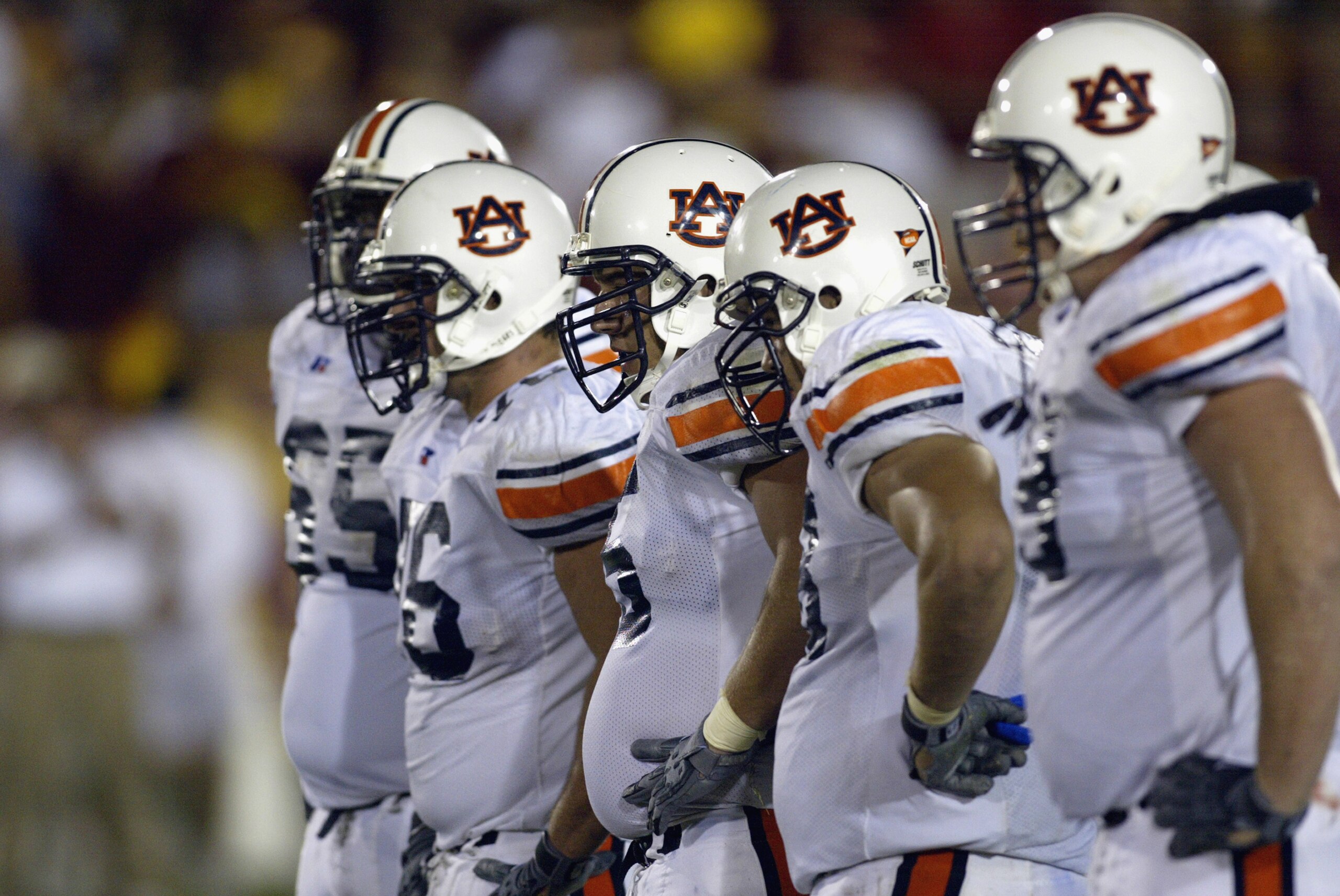 LOS ANGELES - SEPTEMBER 2: The Offensive Line of the Auburn Tigers stand ready before the play against the USC Trojans during the game on September 2, 2002 at the Los Angeles Coliseum in Los Angeles, California. USC defeated Auburn 24-17. (Photo by Ste LOS ANGELES - SEPTEMBER 2: The Offensive Line of the Auburn Tigers stand ready before the play against the USC Trojans during the game on September 2, 2002 at the Los Angeles Coliseum in Los Angeles, California. USC defeated Auburn 24-17. (Photo by Ste