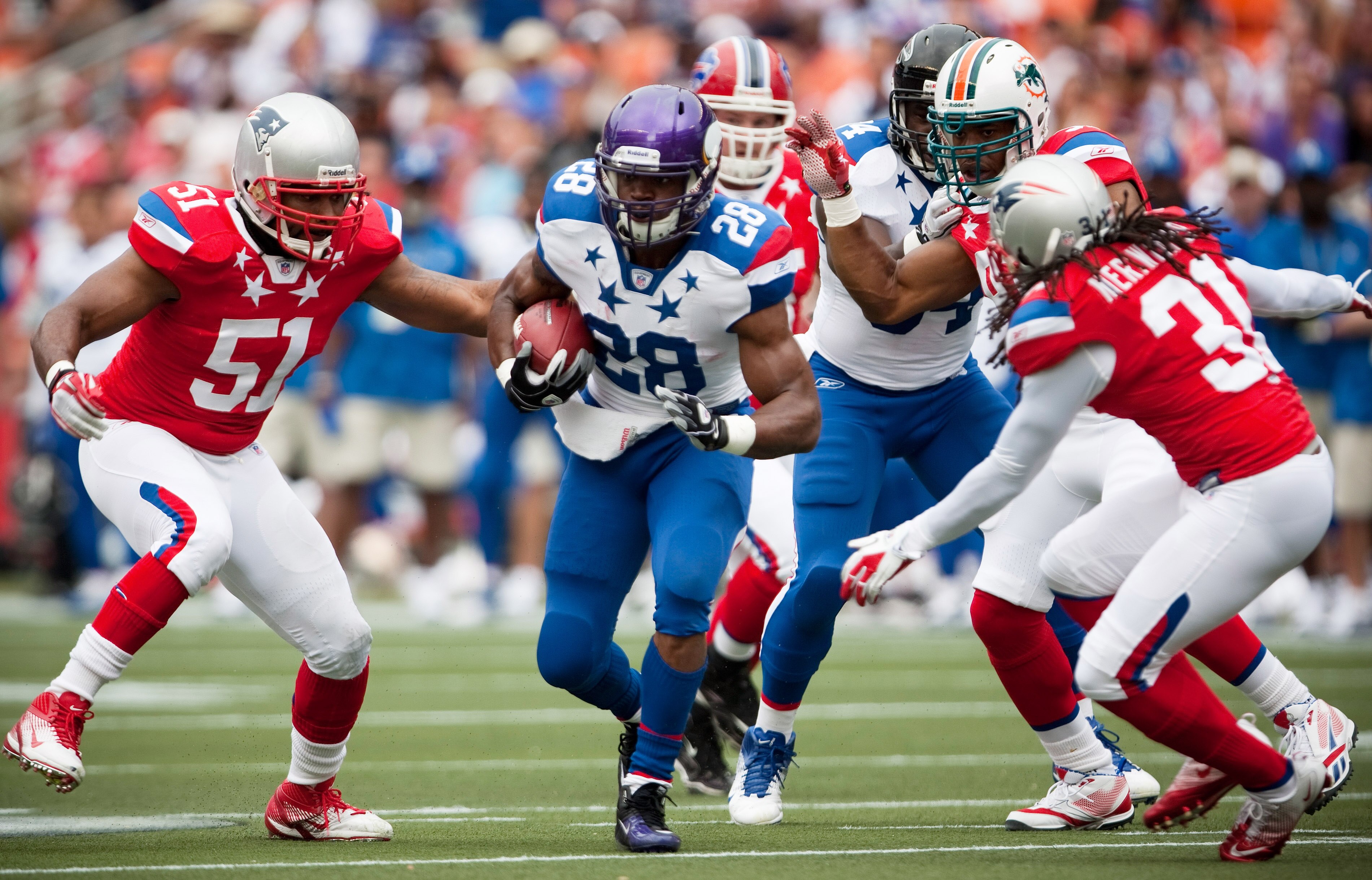 HONOLULU - JANUARY 30:  Adrian Peterson, #28 of the Minnesota Vikings, carries the ball during the 2011 NFL Pro Bowl at Aloha Stadium on January 30, 2011 in Honolulu, Hawaii. NFC won 55-41 over the AFC. (Photo by Kent Nishimura/Getty Images)