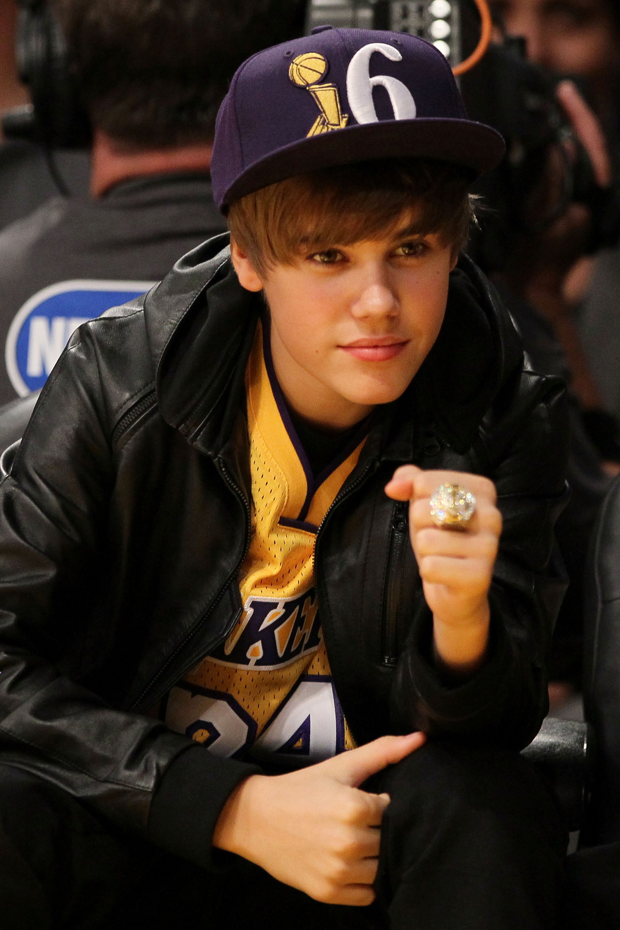 LOS ANGELES, CA - OCTOBER 26:  Singer Justin Bieber wears the championship ring of head coach Phil Jackson of the Los Angeles Lakers as the Lakers play the Houston Rockets during their opening night game at Staples Center on October 26, 2010 in Los Angele