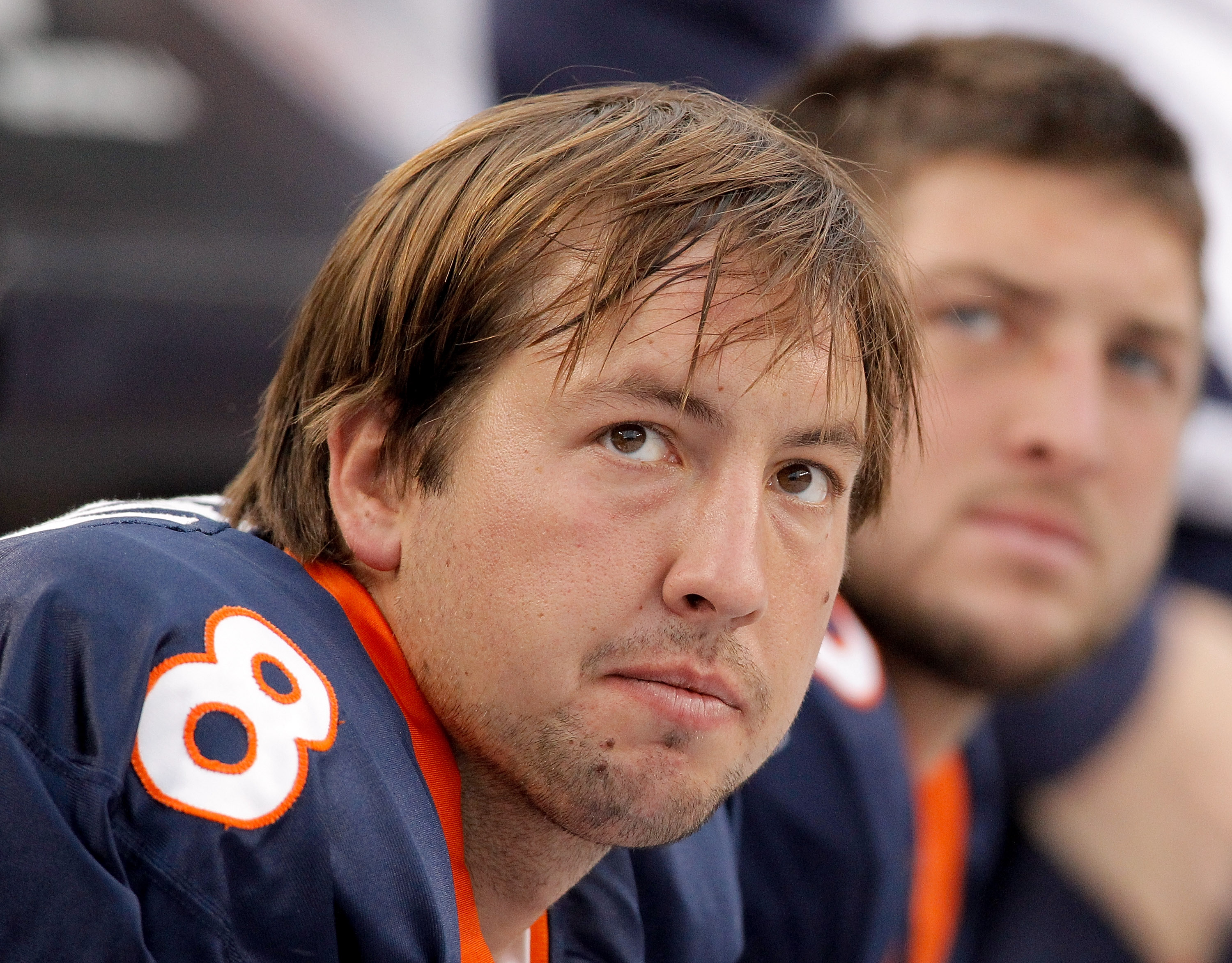 DENVER - OCTOBER 24:  Quarterbacks Kyle Orton #8 and Tim Tebow #15 of the Denver Broncos look on from the bench during their 59-14 loss to the Oakland Raiders at INVESCO Field at Mile High on October 24, 2010 in Denver, Colorado. (Photo by Justin Edmonds/