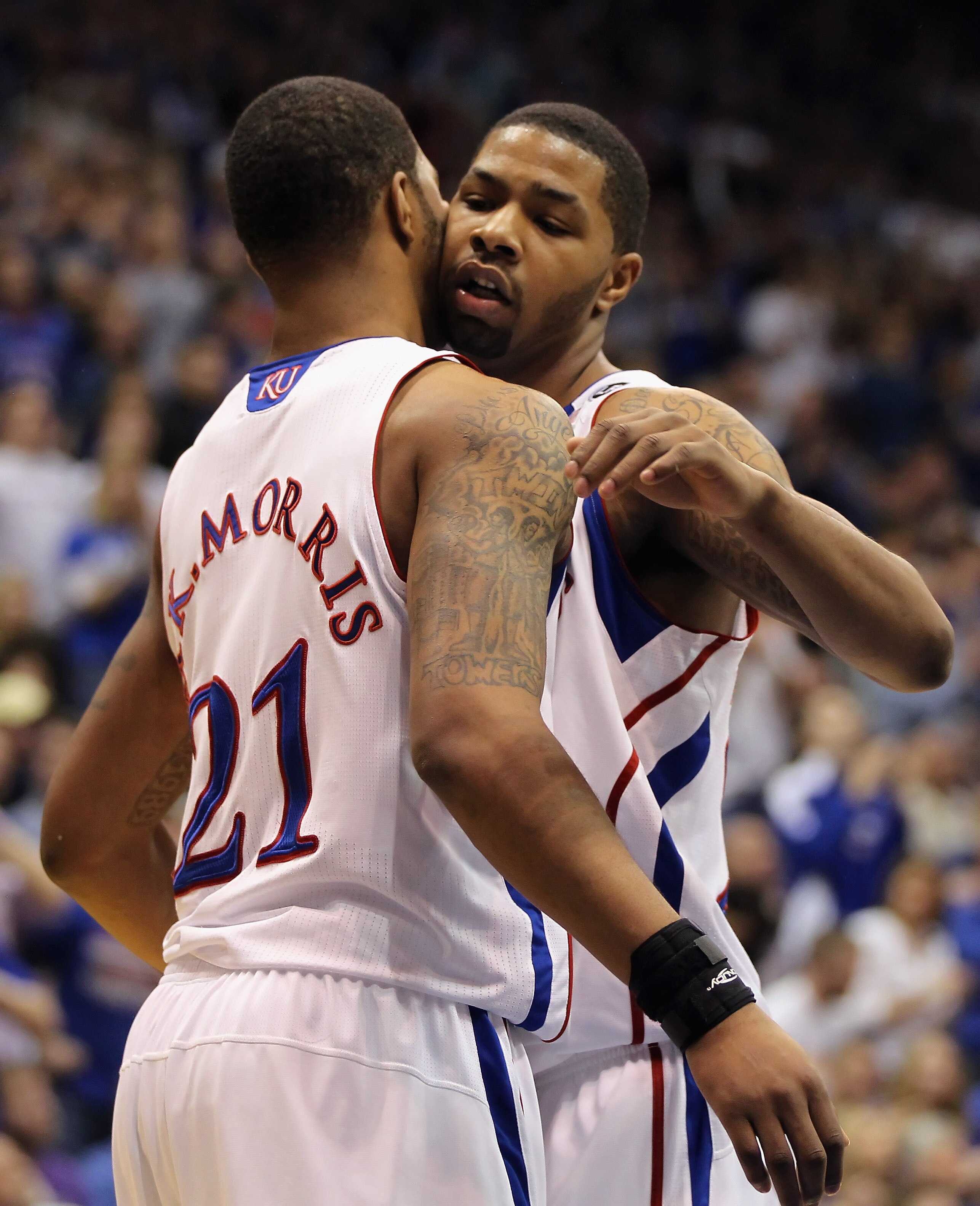 LAWRENCE, KS - JANUARY 29:  Marcus Morris #22 and Markieff Morris #21 of the Kansas Jayhawks celebrate during the game against the Kansas State Wildcats on January 29, 2011 at Allen Fieldhouse in Lawrence, Kansas.  (Photo by Jamie Squire/Getty Images)