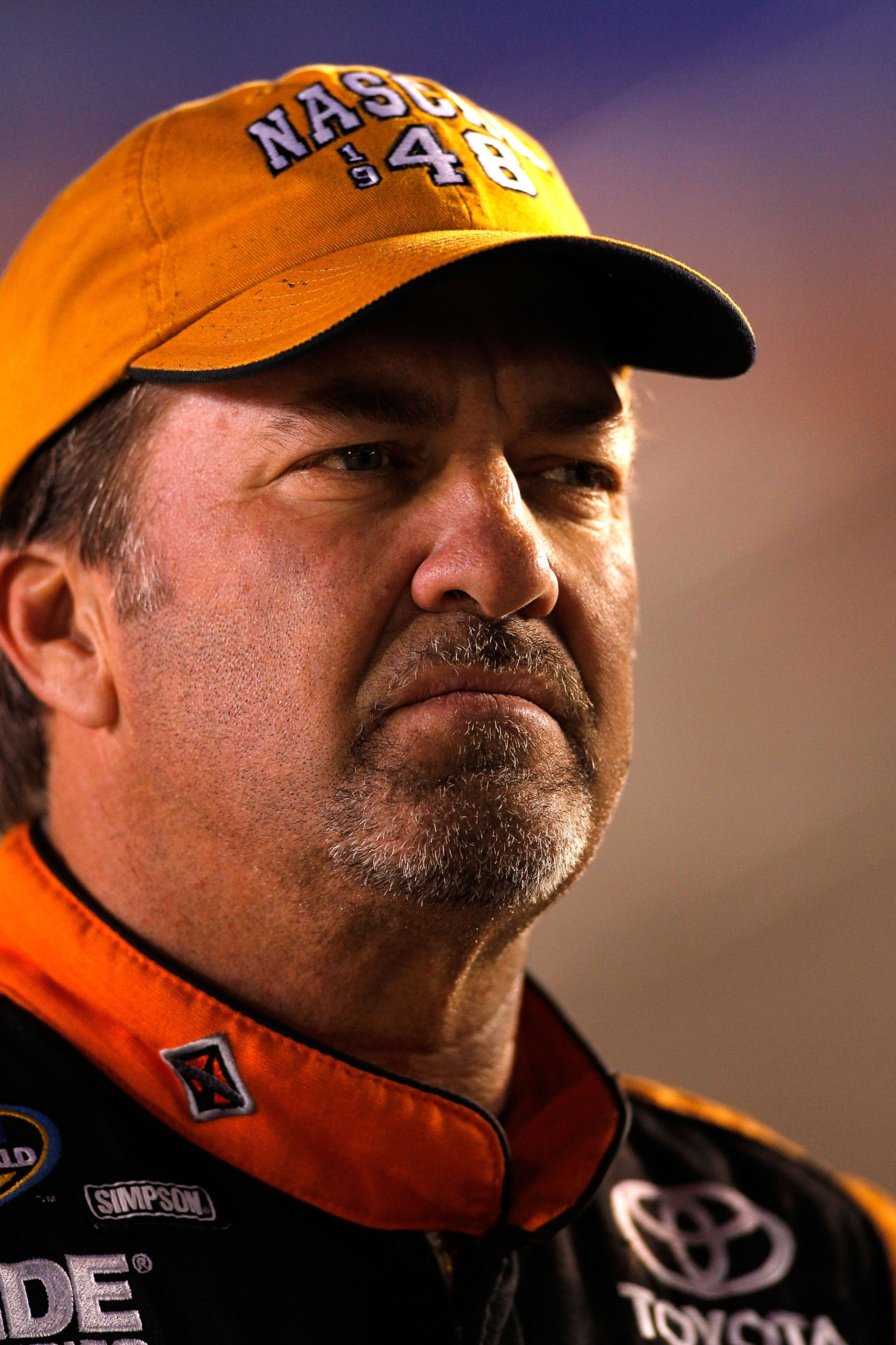 FORT WORTH, TX - NOVEMBER 04:  Mike Skinner, driver of the #5 Exide/International Trucks Toyota, stands on pit road during qualifying for the NASCAR Camping World Truck Series WinStar World Casino 350k at Texas Motor Speedway on November 4, 2010 in Fort W