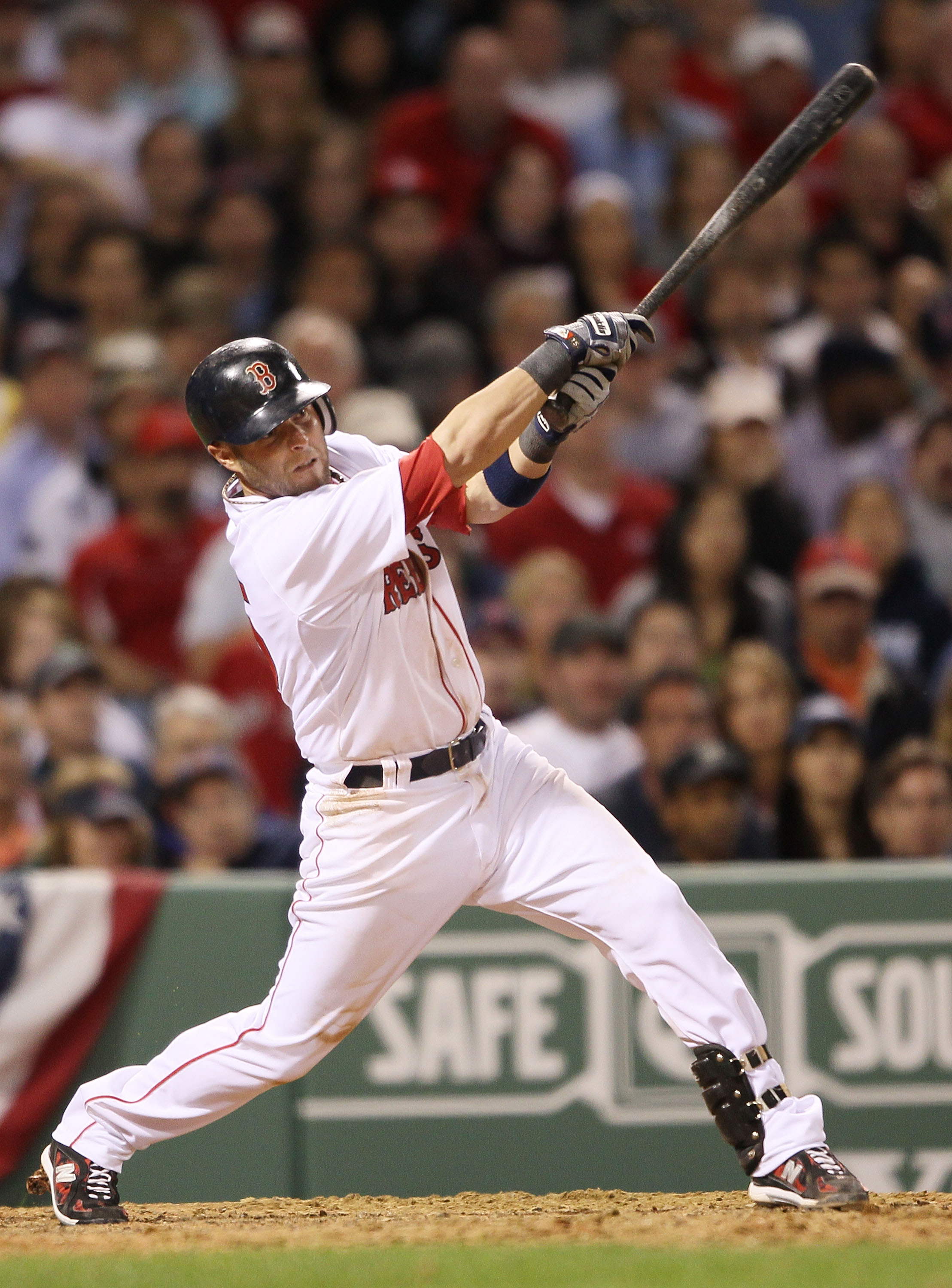 BOSTON - APRIL 04:  Dustin Pedroia #15 of the Boston Red Sox gets a hit in the sixth inning against the New York Yankees on April 4, 2010 during Opening Night at Fenway Park in Boston, Massachusetts.  (Photo by Elsa/Getty Images)