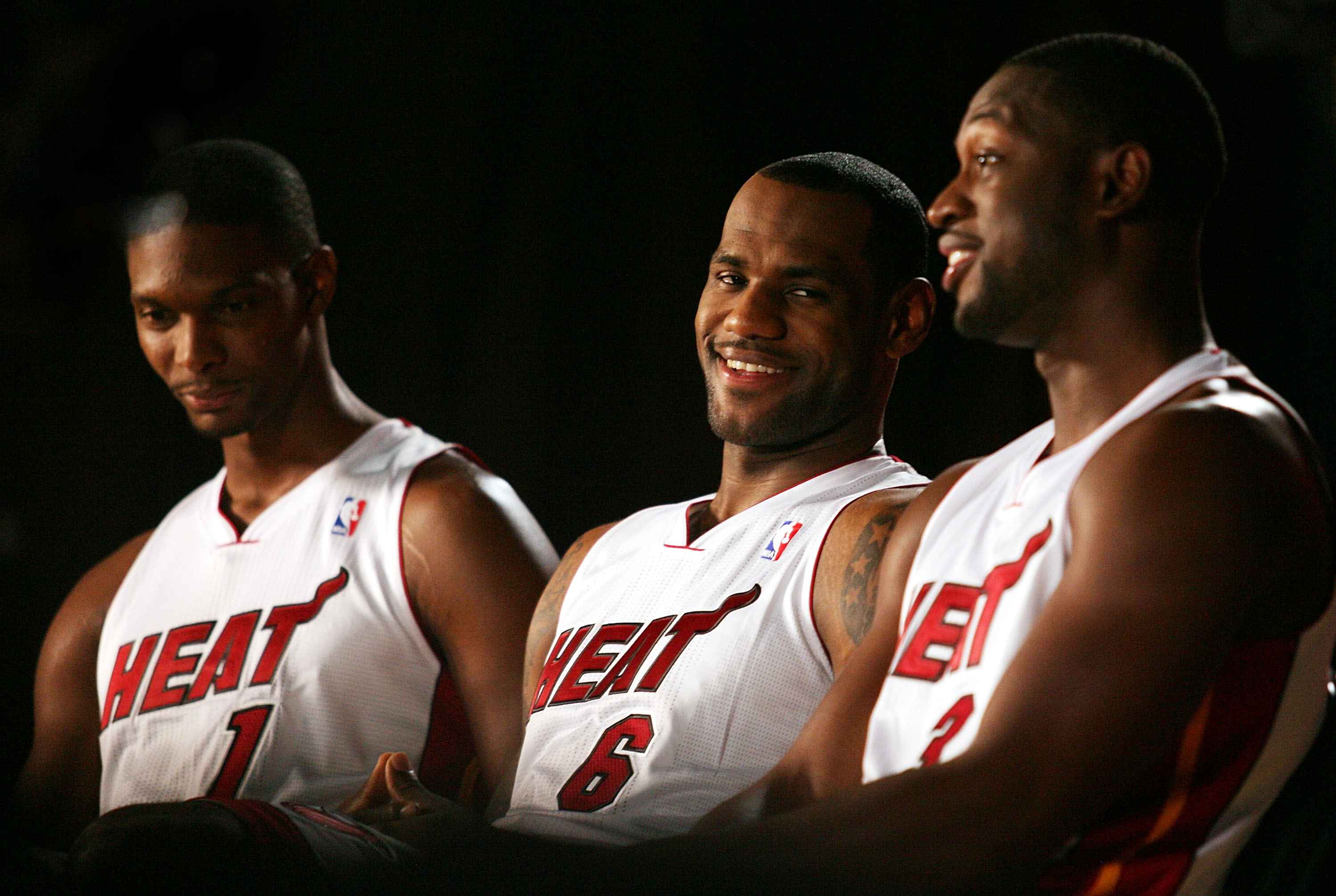 MIAMI - SEPTEMBER 27:  (L-R) Chris Bosh, LeBron James and Dwyane Wade of the Miami Heat answer questions during media day at the Bank United Center on September 27, 2010 in Miami, Florida.  (Photo by Marc Serota/Getty Images)