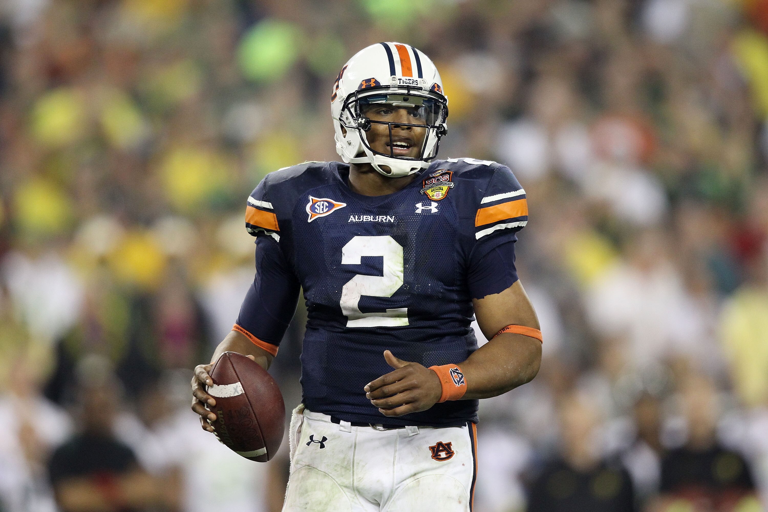 GLENDALE, AZ - JANUARY 10:  Cameron Newton #2 of the Auburn Tigers scrambles against the Oregon Ducks during the Tostitos BCS National Championship Game at University of Phoenix Stadium on January 10, 2011 in Glendale, Arizona.  (Photo by Christian Peters