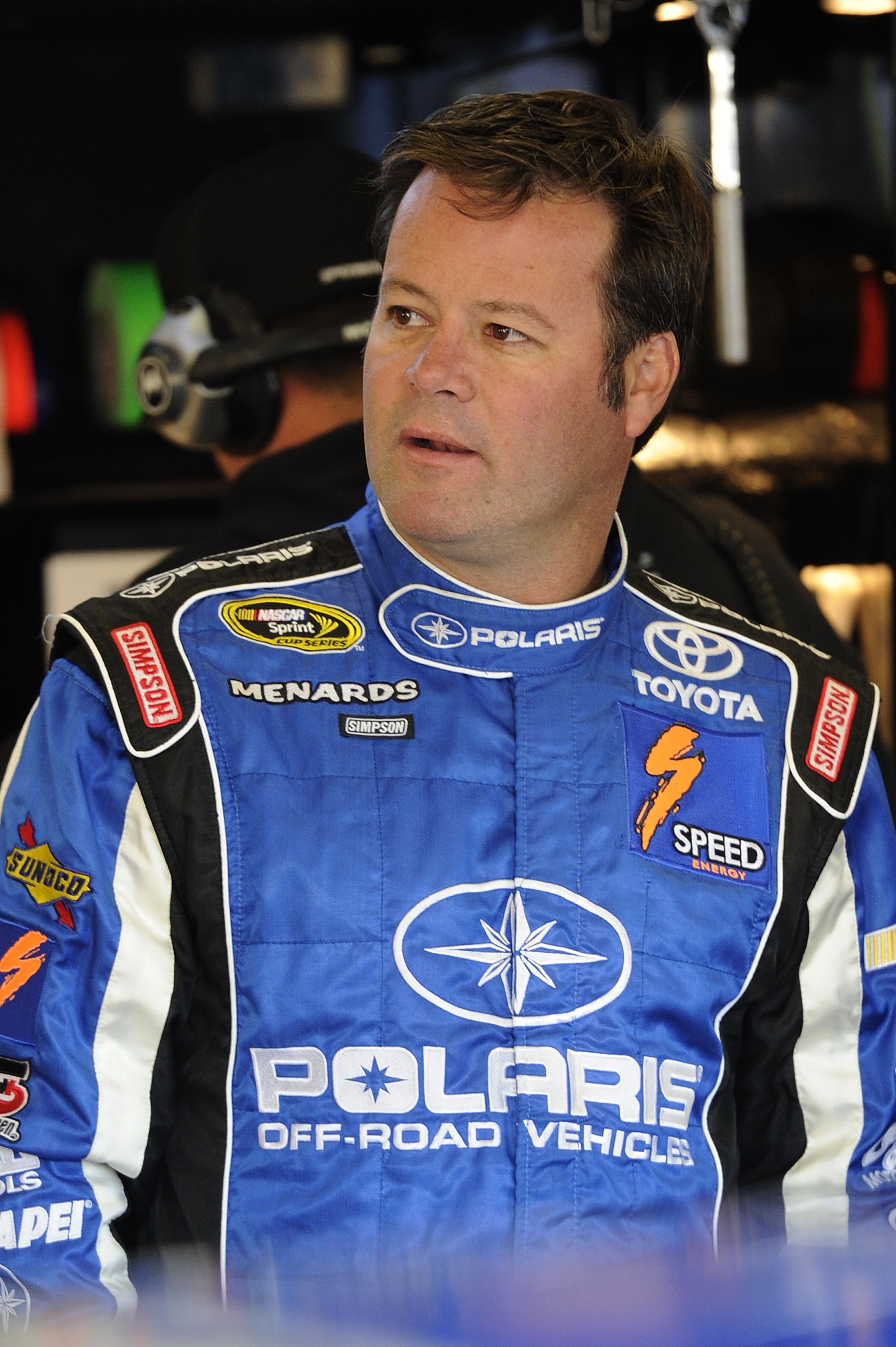 FORT WORTH, TX - NOVEMBER 06:  Robby Gordon, driver of the #7 MAPEI/Menards Toyota, stands in the garage area during practice for the NASCAR Sprint Cup Series AAA Texas 500 at Texas Motor Speedway on November 6, 2010 in Fort Worth, Texas.  (Photo by John