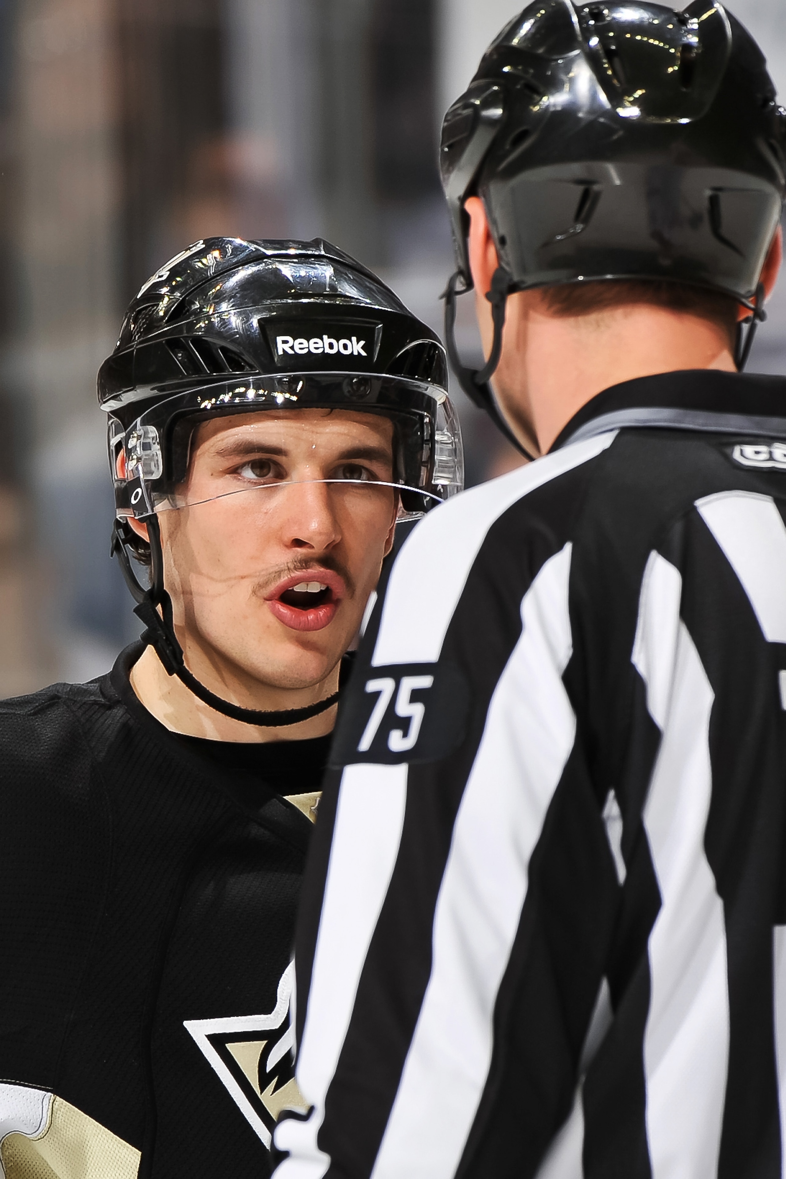 PITTSBURGH, PA - DECEMBER 20:  Sidney Crosby #87 of the Pittsburgh Penguins talks with a linesman during a break in the action against the Phoenix Coyotes on December 20, 2010 at CONSOL Energy Center in Pittsburgh, Pennsylvania.  (Photo by Jamie Sabau/Get