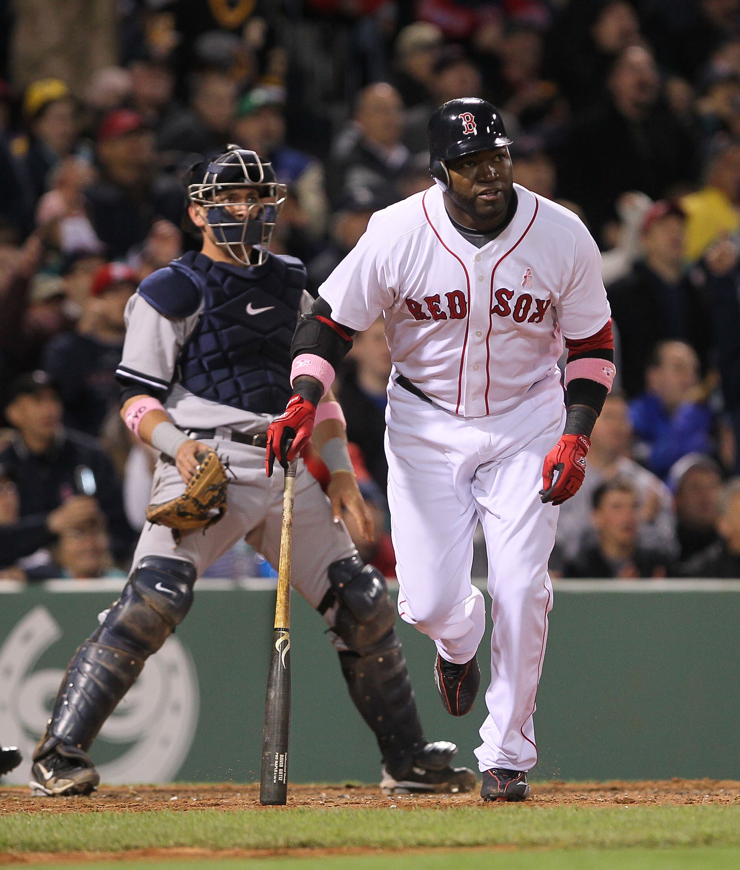 BOSTON - MAY 9:  David Ortiz #34 of the Boston Red Sox hits a ground rule double to right field to score Dustin Pedroia in the third inning against the New York Yankees at Fenway Park on May 9, 2010 in Boston, Massachusetts. (Photo by Jim Rogash/Getty Ima