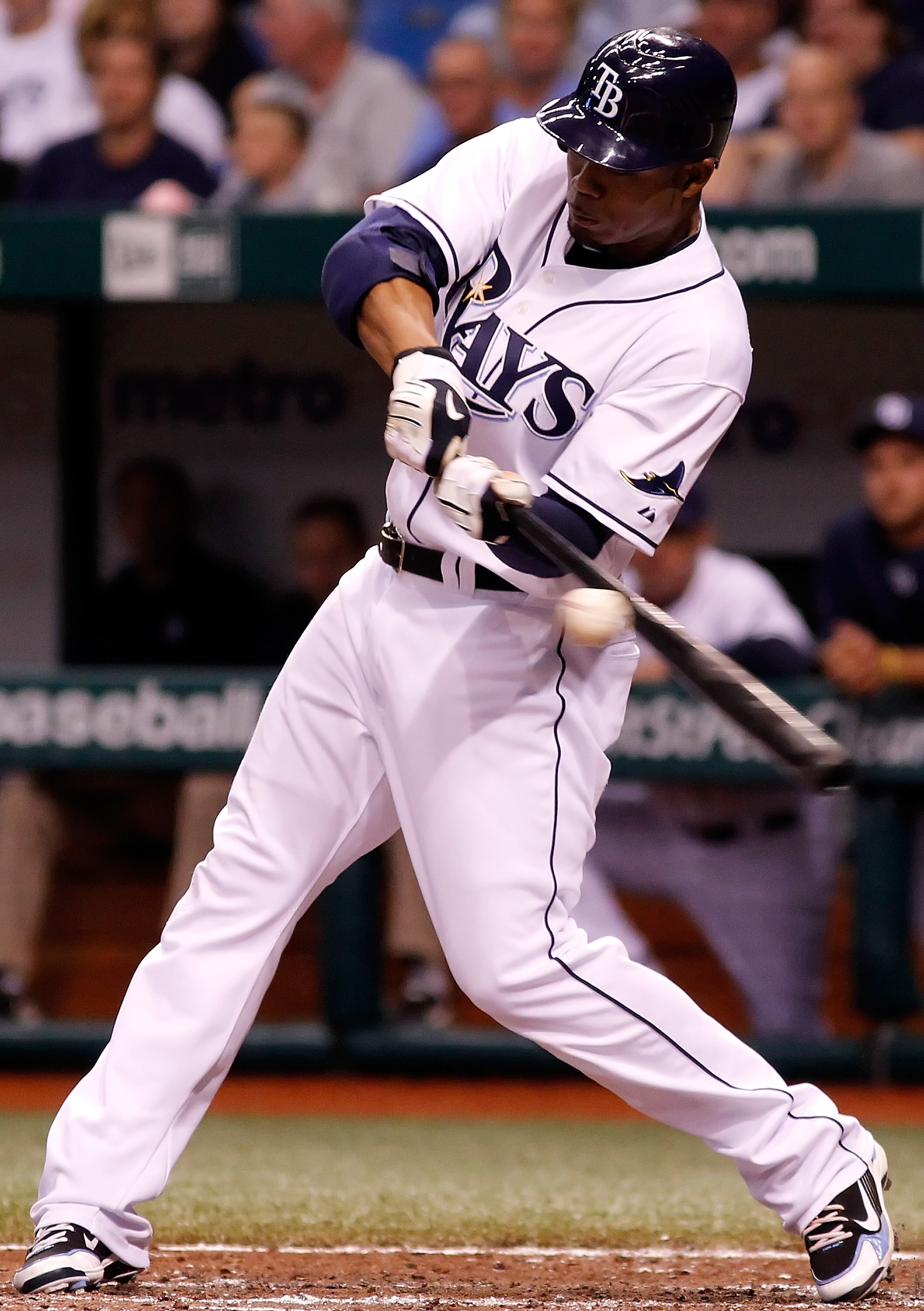 ST. PETERSBURG - MAY 01:  Outfielder Carl Crawford #13 of the Tampa Bay Rays fouls off a pitch against the Kansas City Royals during the game at Tropicana Field on May 1, 2010 in St. Petersburg, Florida.  (Photo by J. Meric/Getty Images)