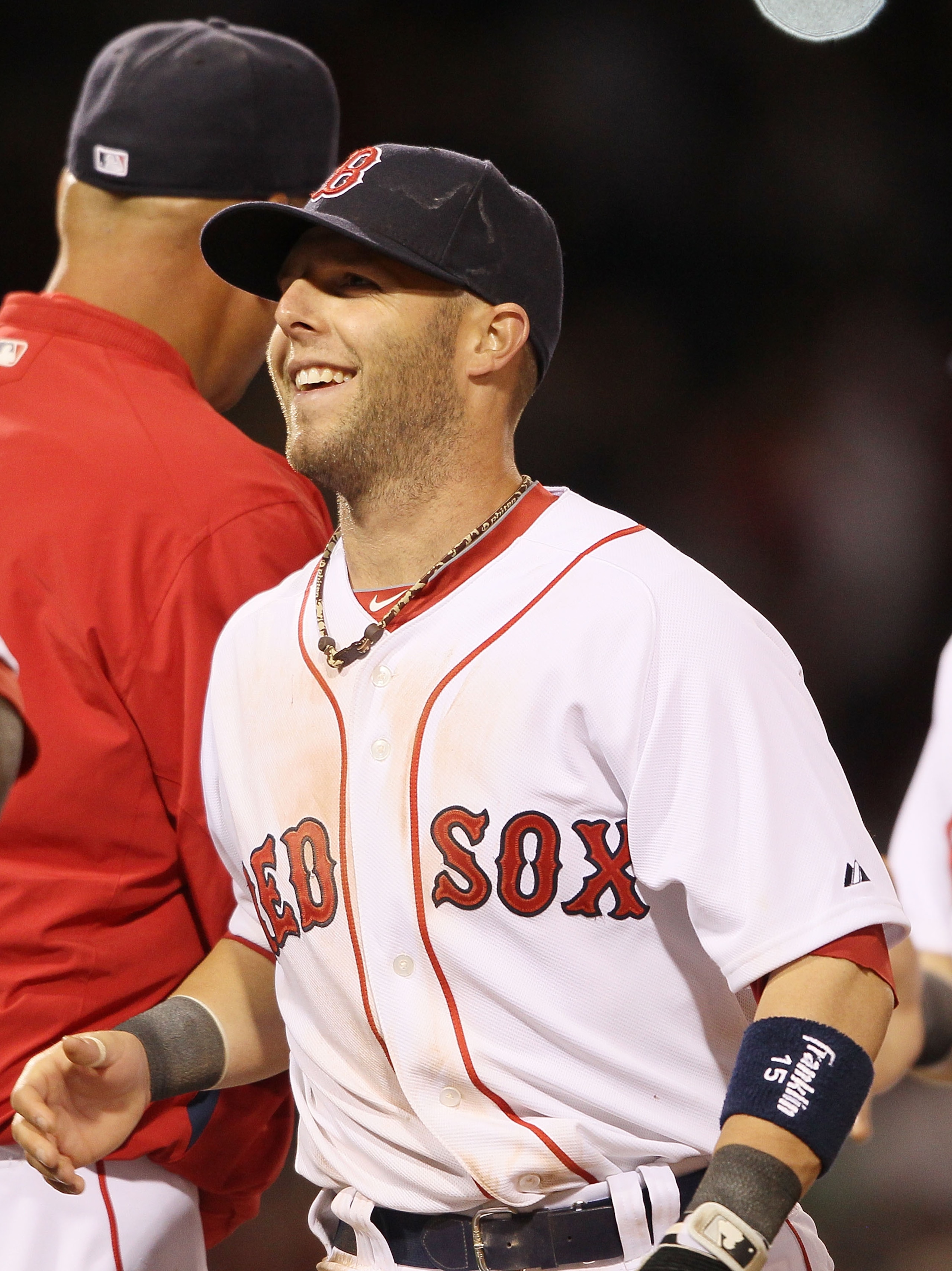 BOSTON - APRIL 04:  Dustin Pedroia # 15 of the Boston Red Sox celebrates the win over the New York Yankees on April 4, 2010 during Opening Night at Fenway Park in Boston, Massachusetts. The Red Sox defeated the Yankees 9-7.  (Photo by Elsa/Getty Images)