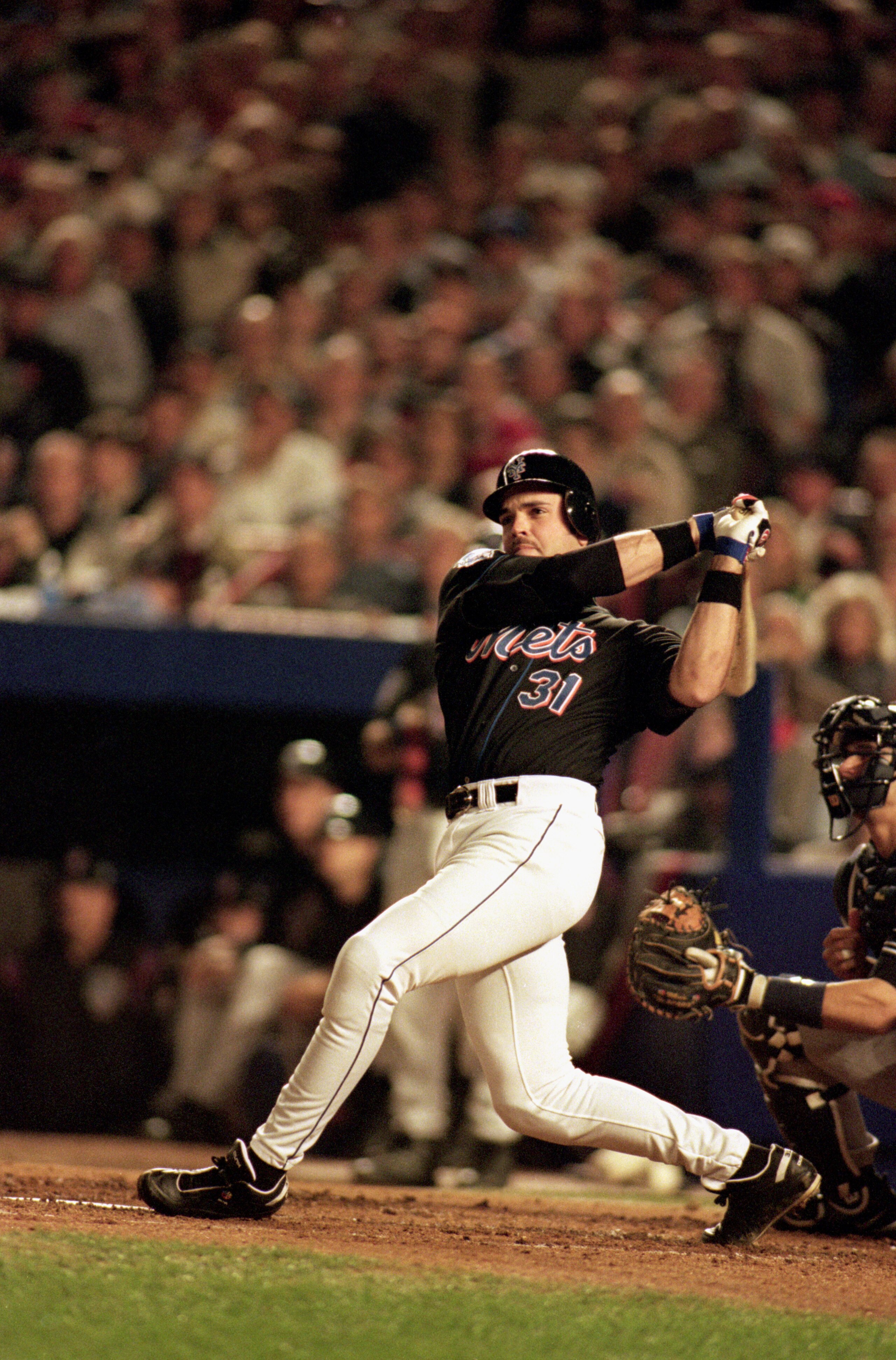 FLUSHING, NY - OCTOBER 25:  Mike Piazza #31 of the New York Mets swings at a New York Yankees pitch during game 4 of the World Series at Shea Stadium on October 25, 2000, in Flushing, New York.  The Mets won 2-0. (Photo by Al Bello/Getty Images)