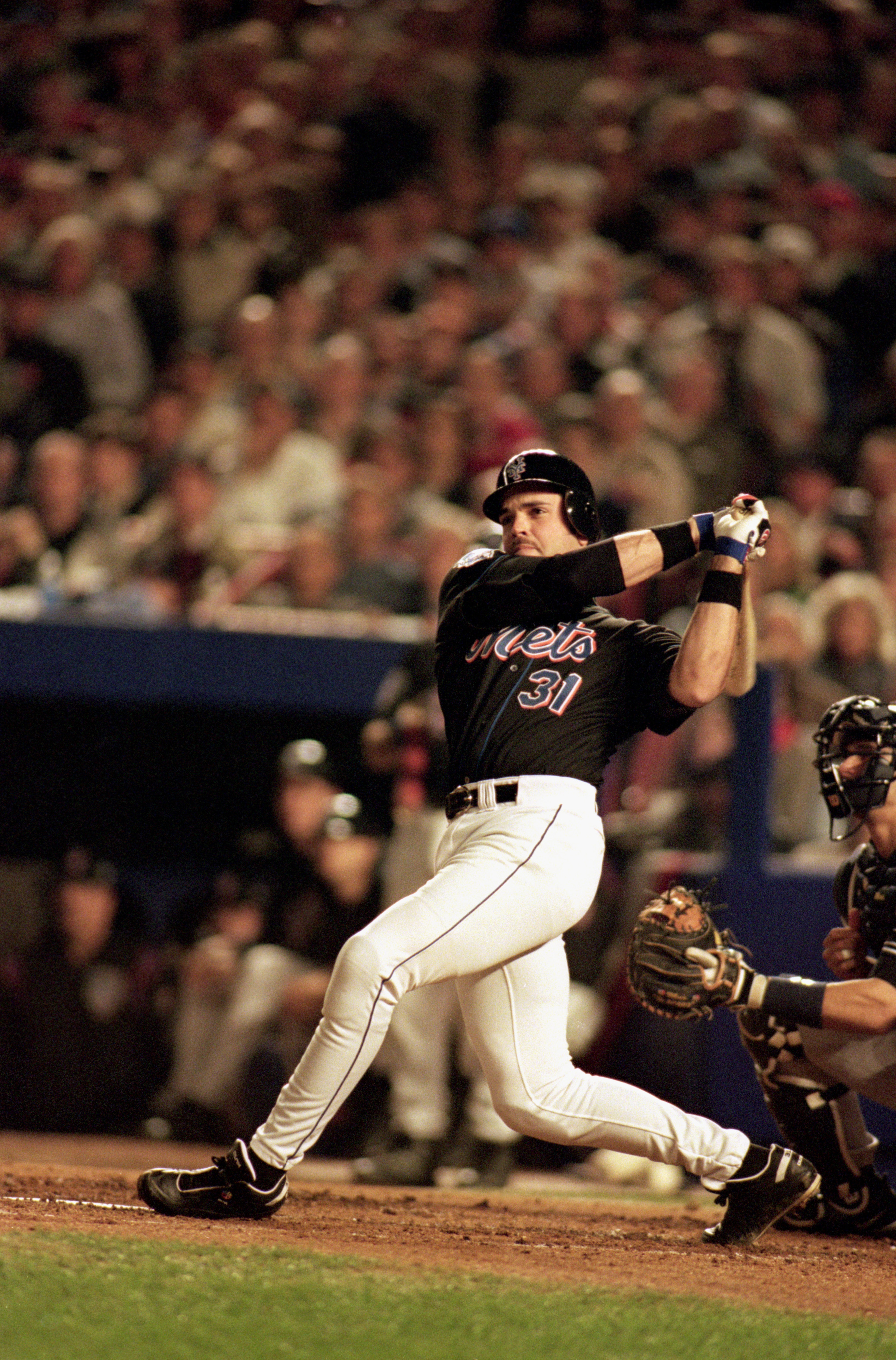 FLUSHING, NY - OCTOBER 25:  Mike Piazza #31 of the New York Mets swings at a New York Yankees pitch during game 4 of the World Series at Shea Stadium on October 25, 2000, in Flushing, New York.  The Mets won 2-0. (Photo by Al Bello/Getty Images)
