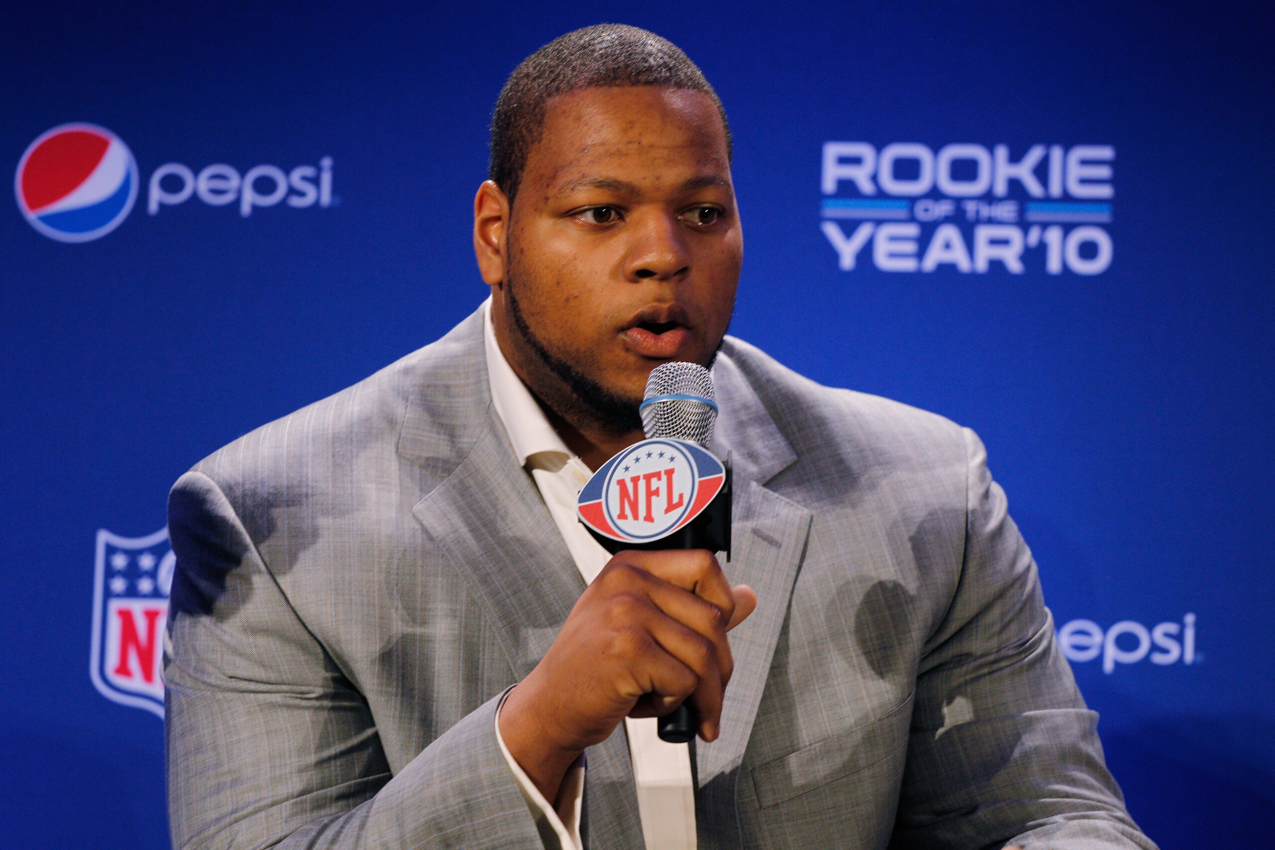 DALLAS, TX - FEBRUARY 03: Ndamukong Suh #90 of the Detroit Lions speaks during a press conference where he accepted Pepsi's 2010 NFL Rookie of the Year Award at the Super Bowl XLV media center on February 3, 2011 in Dallas, Texas. The Green Bay Packers w DALLAS, TX - FEBRUARY 03: Ndamukong Suh #90 of the Detroit Lions speaks during a press conference where he accepted Pepsi's 2010 NFL Rookie of the Year Award at the Super Bowl XLV media center on February 3, 2011 in Dallas, Texas. The Green Bay Packers w