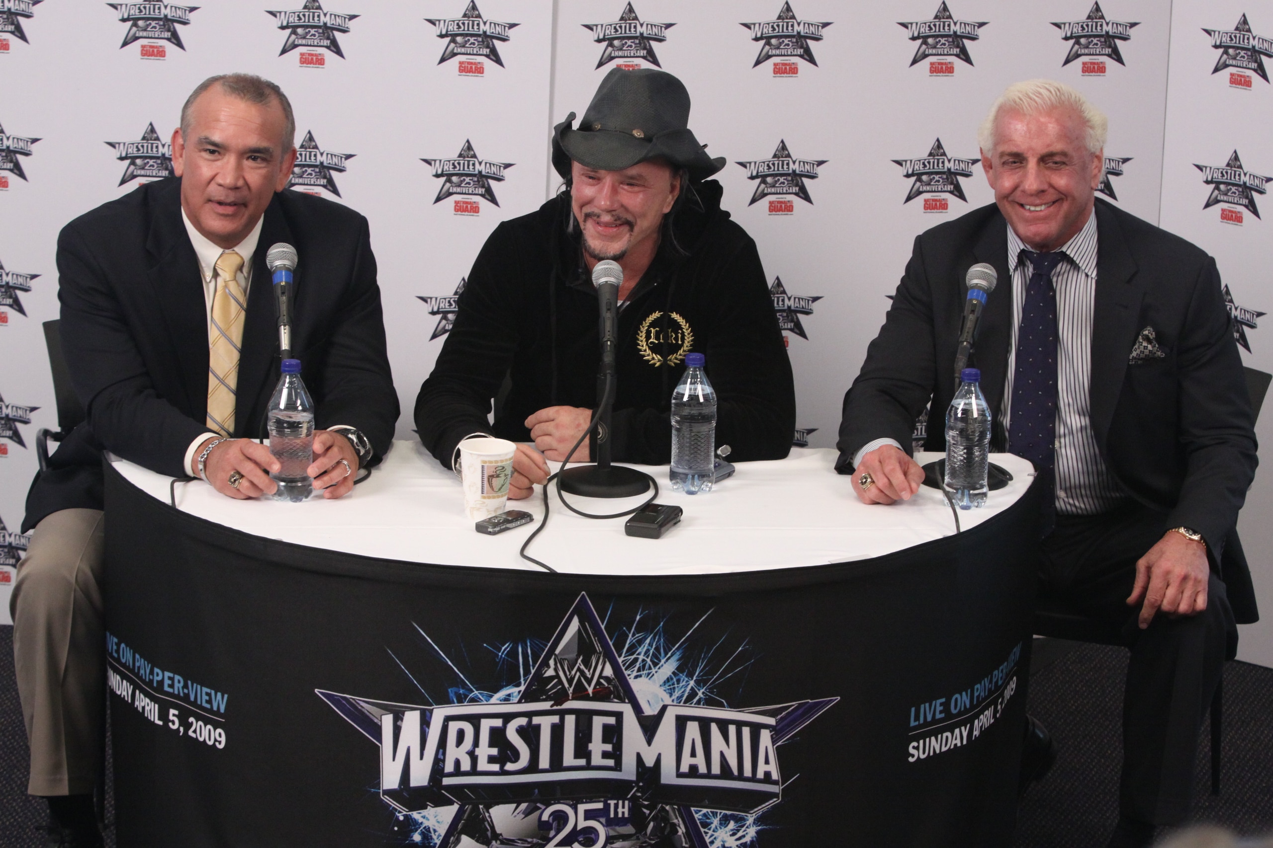 HOUSTON, TX - APRIL 5:  Former professional wrestler Ricky 'The Dragon' Steamboat and 'Nature Boy' Ric Flair looks on as actor Mickey Rourke discusses his wishes to not get involved in a match with WWE Superstar Chris Jericho during a press conference bef