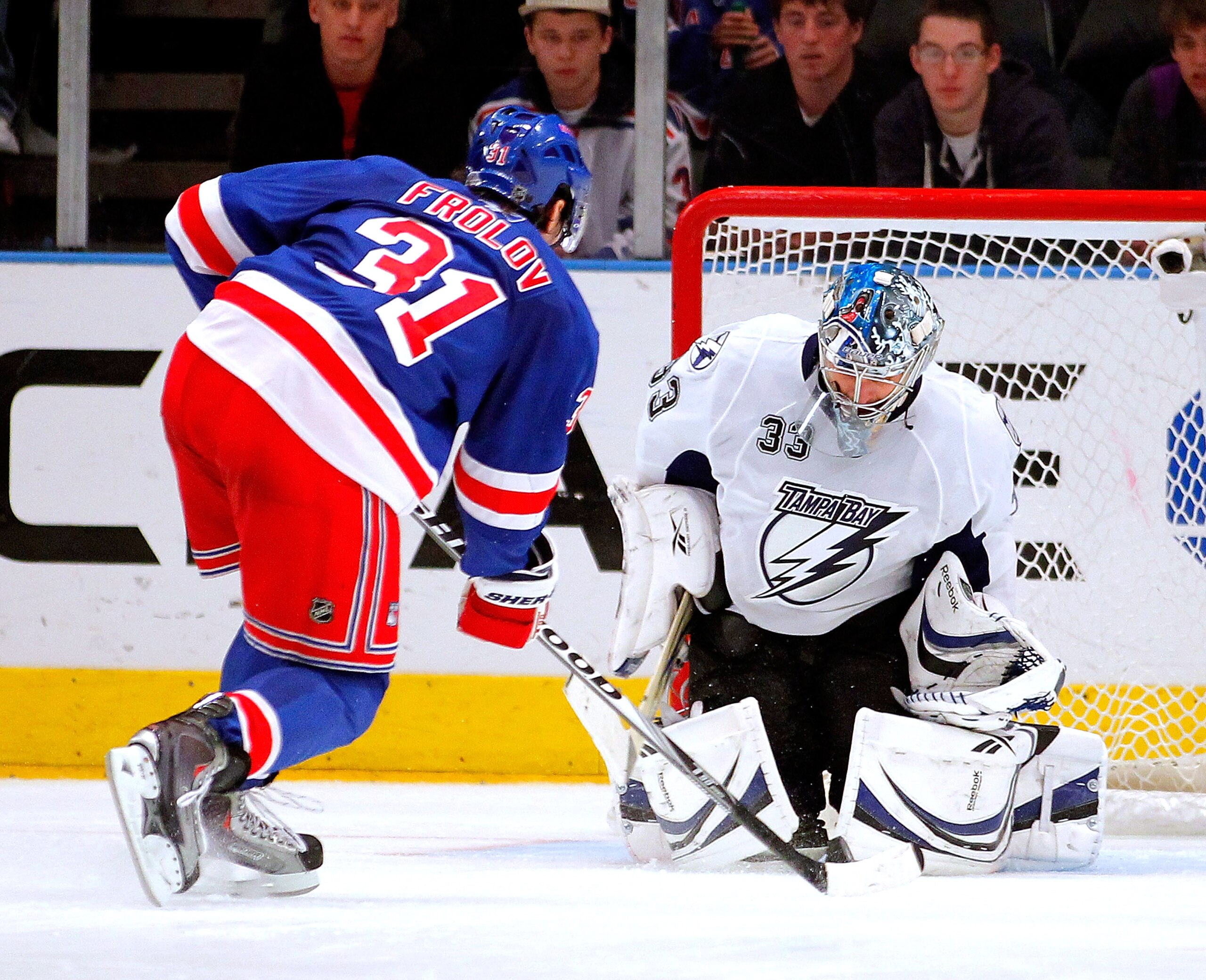 NEW YORK, NY - DECEMBER 23: Alex Frolov #31 of the New York Rangers is stopped by Goalie Dan Ellis #33 of the Tampa Bay Lightning during the shootout of an NHL hockey game at Madison Square Garden on December 23, 2010 in New York City. (Photo by Paul Be NEW YORK, NY - DECEMBER 23: Alex Frolov #31 of the New York Rangers is stopped by Goalie Dan Ellis #33 of the Tampa Bay Lightning during the shootout of an NHL hockey game at Madison Square Garden on December 23, 2010 in New York City. (Photo by Paul Be