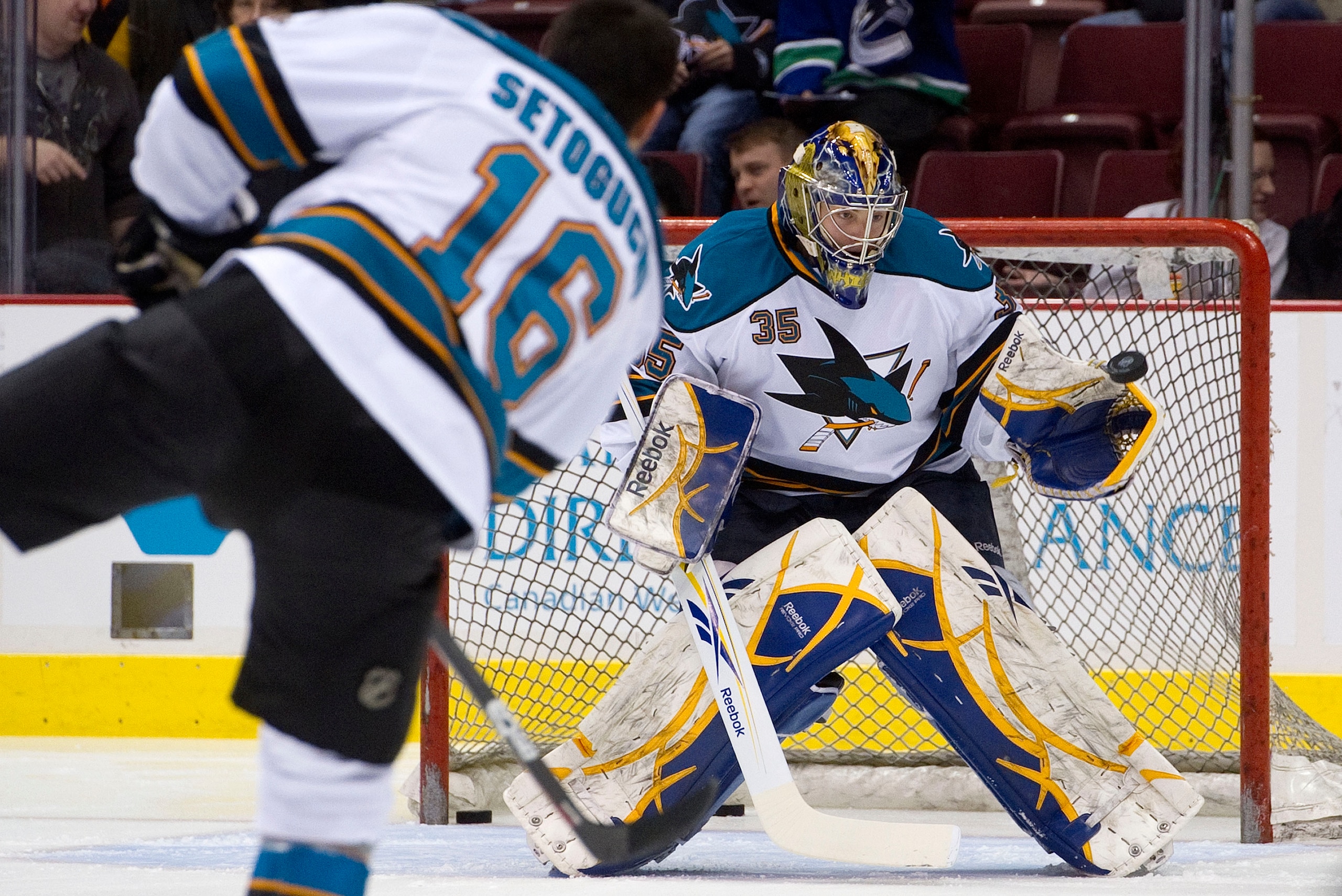 VANCOUVER, CANADA - JANUARY 20: Backup goalie Jordan White #35 of the San Jose Sharks makes a glove save on Devin Setoguchi #16 during pre game skate prior to NHL action against the Vancouver Canucks on January 20, 2011 at Rogers Arena in Vancouver, BC, C