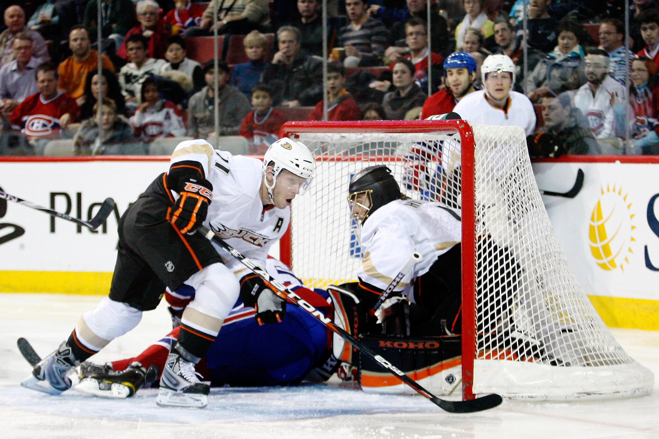 MONTREAL, CANADA - JANUARY 22: Saku Koivu #11 of the Anaheim Ducks checks Max Pacioretty #67 of the Montreal Canadiens into team mate Jonas Hiller #1 during the NHL game at the Bell Centre on January 22, 2011 in Montreal, Quebec, Canada. (Photo by Richa MONTREAL, CANADA - JANUARY 22: Saku Koivu #11 of the Anaheim Ducks checks Max Pacioretty #67 of the Montreal Canadiens into team mate Jonas Hiller #1 during the NHL game at the Bell Centre on January 22, 2011 in Montreal, Quebec, Canada. (Photo by Richa