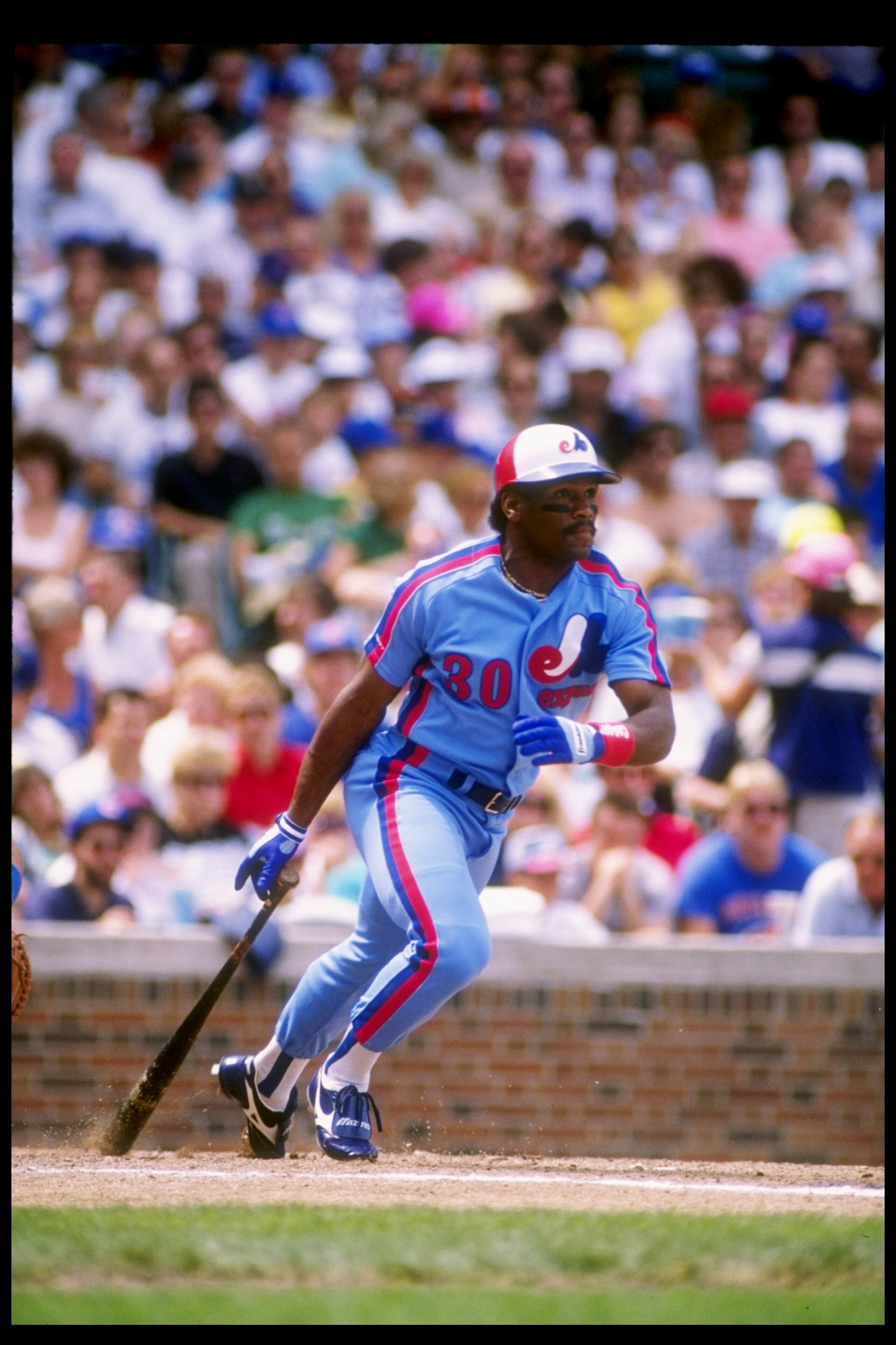 Outfielder Tim Raines of the Montreal Expos drops his bat and prepares to run. Outfielder Tim Raines of the Montreal Expos drops his bat and prepares to run.