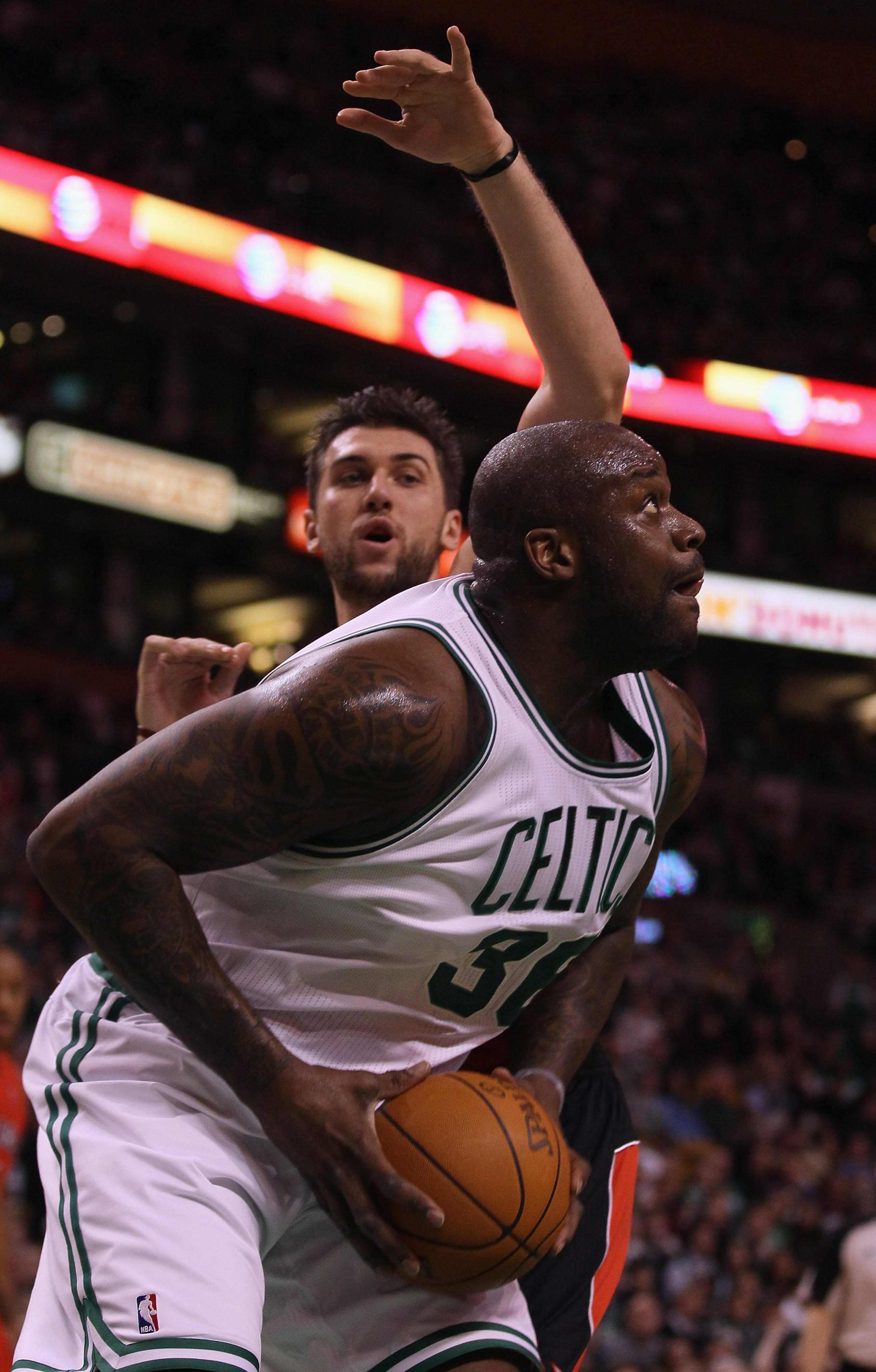 BOSTON, MA - JANUARY 07: Shaquille O'Neal #36 of the Boston Celtics heads for the basket as Andrea Bargnani #7 of the Toronto Raptors defends on January 7, 2011 at the TD Garden in Boston, Massachusetts. NOTE TO USER: User expressly acknowledges and agre BOSTON, MA - JANUARY 07: Shaquille O'Neal #36 of the Boston Celtics heads for the basket as Andrea Bargnani #7 of the Toronto Raptors defends on January 7, 2011 at the TD Garden in Boston, Massachusetts. NOTE TO USER: User expressly acknowledges and agre