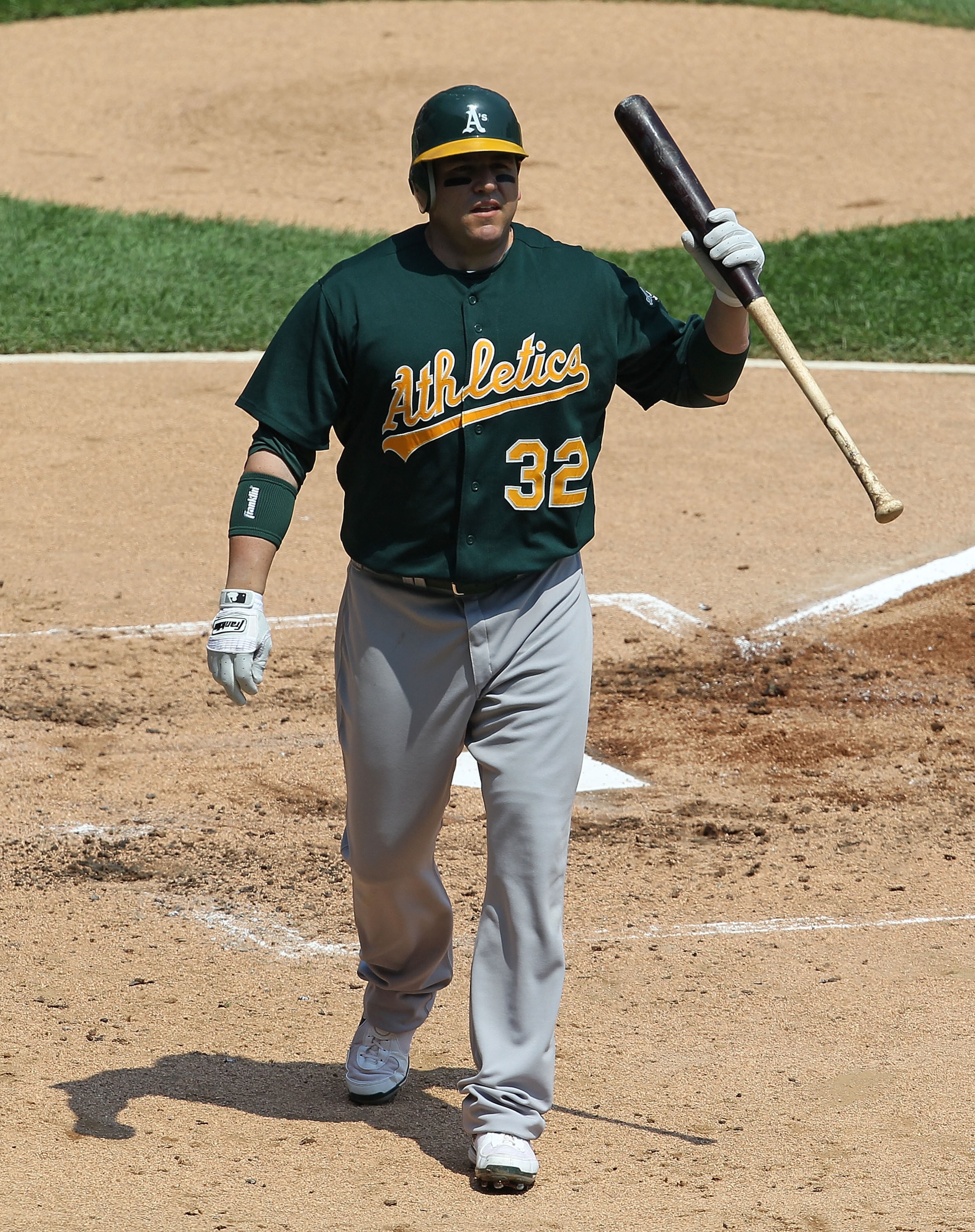 CHICAGO - AUGUST 01: Jack Cust #32 of the Oakland Athletics walks back to the dugout after striking out against Gavin Floyd of the Chicago White Sox at U.S. Cellular Field on August 1, 2010 in Chicago, Illinois. The White Sox defeated the Athletics 4-1. (