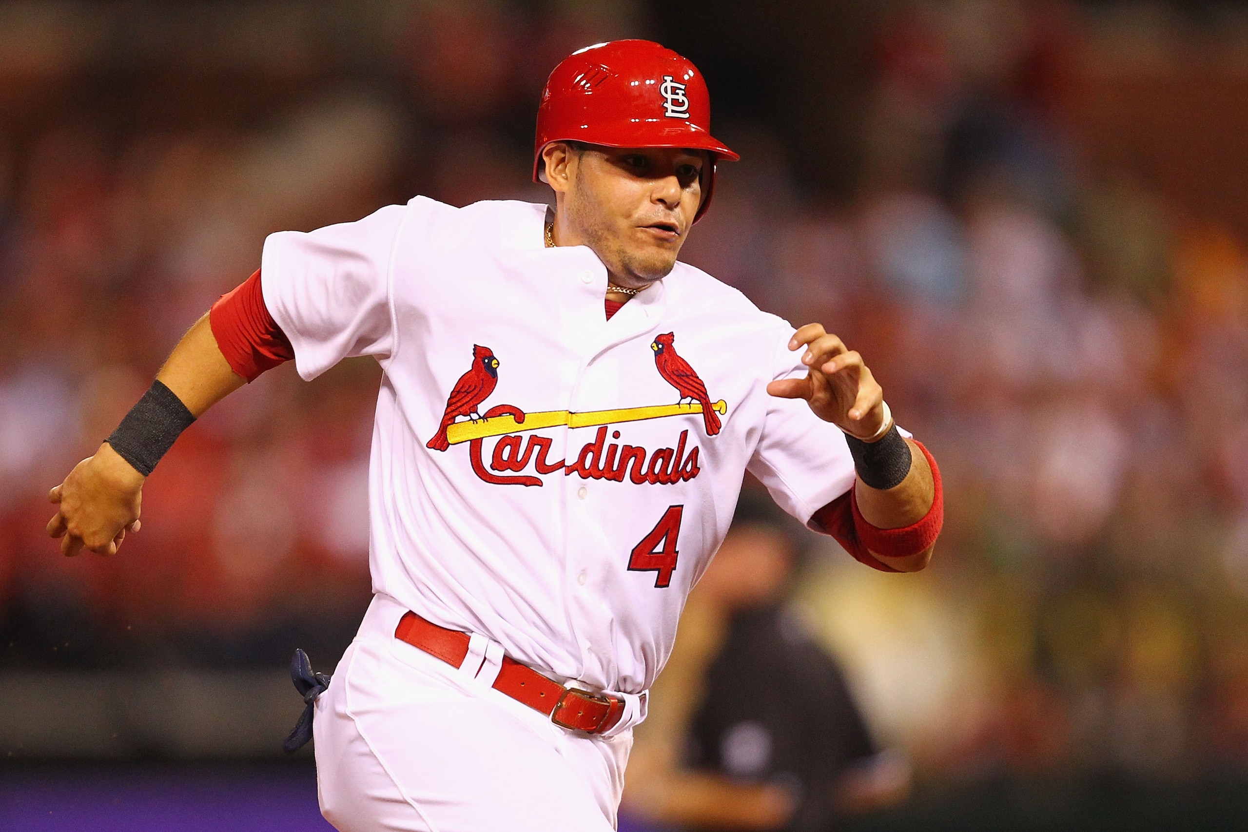 ST. LOUIS - SEPTEMBER 17: Yadier Molina #4 of the St. Louis Cardinals rounds second base against the San Diego Padres at Busch Stadium on September 17, 2010 in St. Louis, Missouri.  (Photo by Dilip Vishwanat/Getty Images)