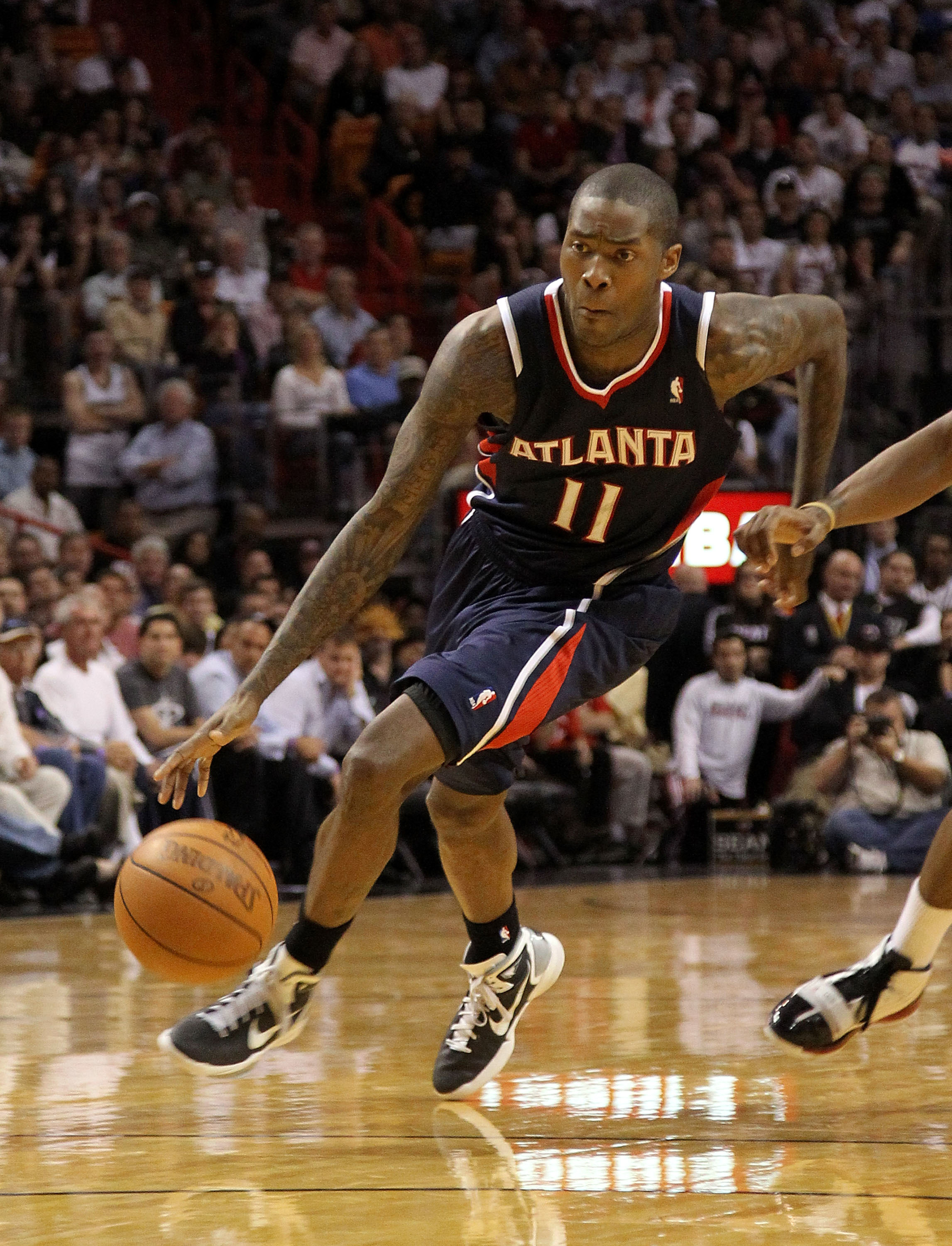 MIAMI, FL - JANUARY 18:  Jamal Crawford #11 of the Atlanta Hawks drives to the lane during a game against the Miami Heat at American Airlines Arena on January 18, 2011 in Miami, Florida. NOTE TO USER: User expressly acknowledges and agrees that, by downlo