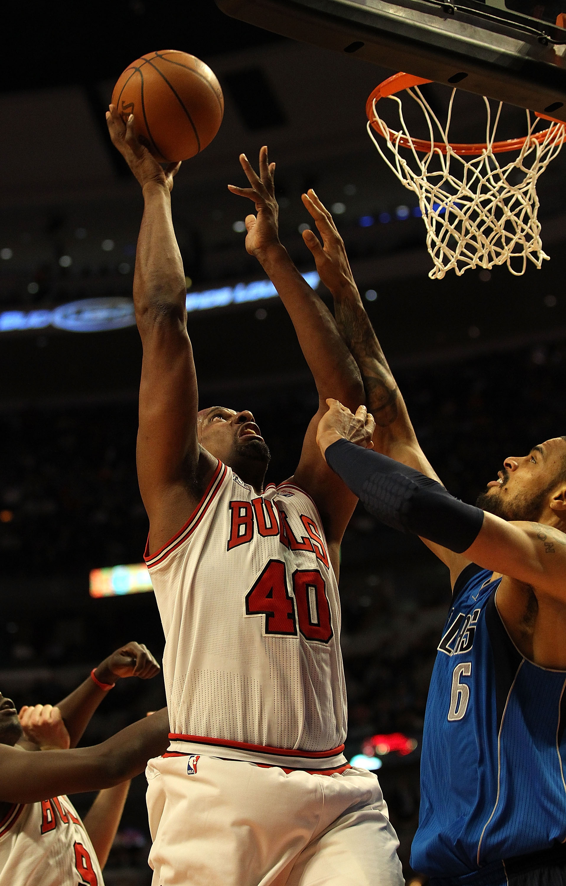 CHICAGO, IL - JANUARY 20: Kurt Thomas #40 of the Chicago Bulls goes up for a shot against Tyson Chandler #6 of the Dallas Mavericks at the United Center on January 20, 2011 in Chicago, Illinois. The Bulls defeated the Mavericks 82-77. NOTE TO USER: User e